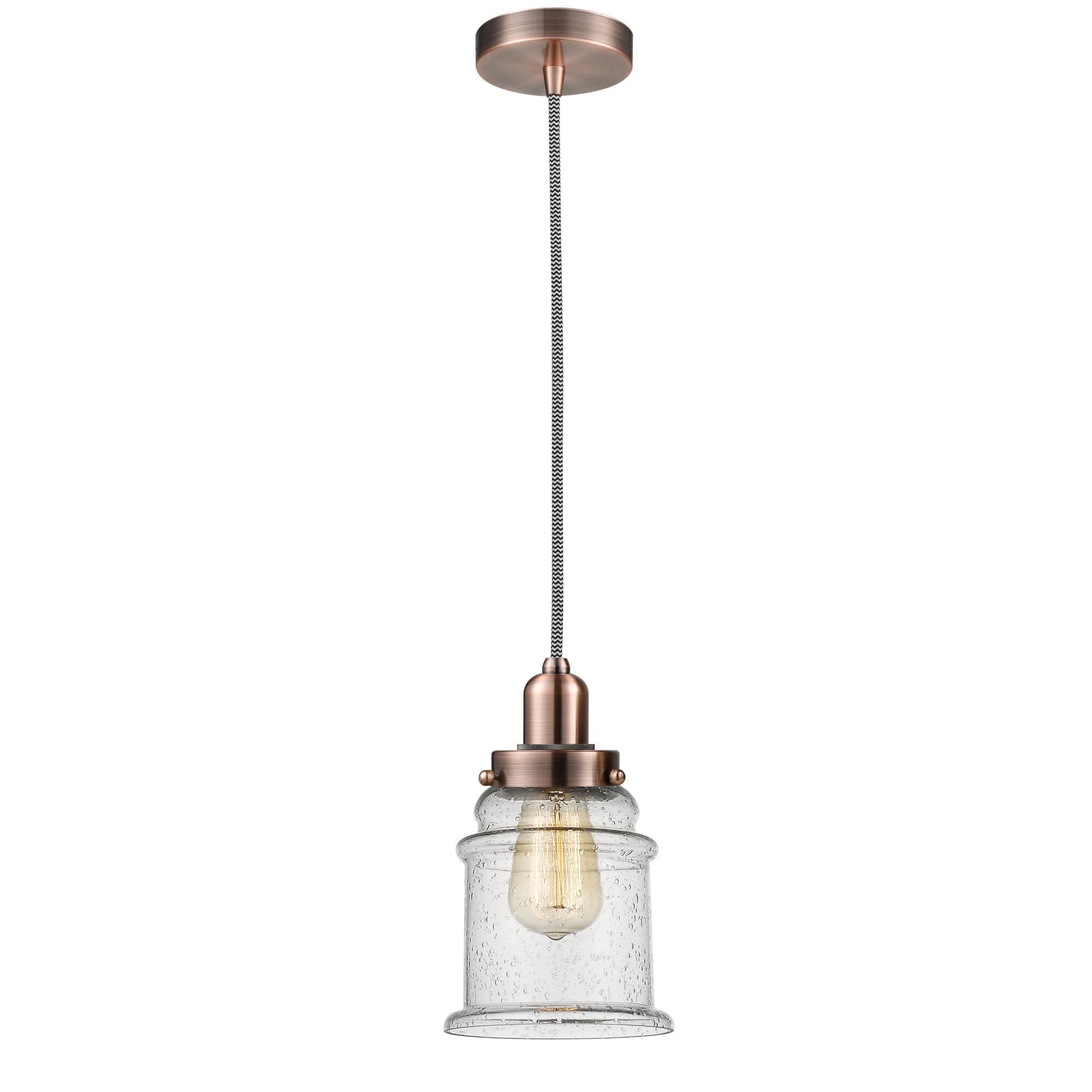 Shown in Antique Copper finish and Bell glass and Glass shade and Antique Copper Whitney Socket Cover accent