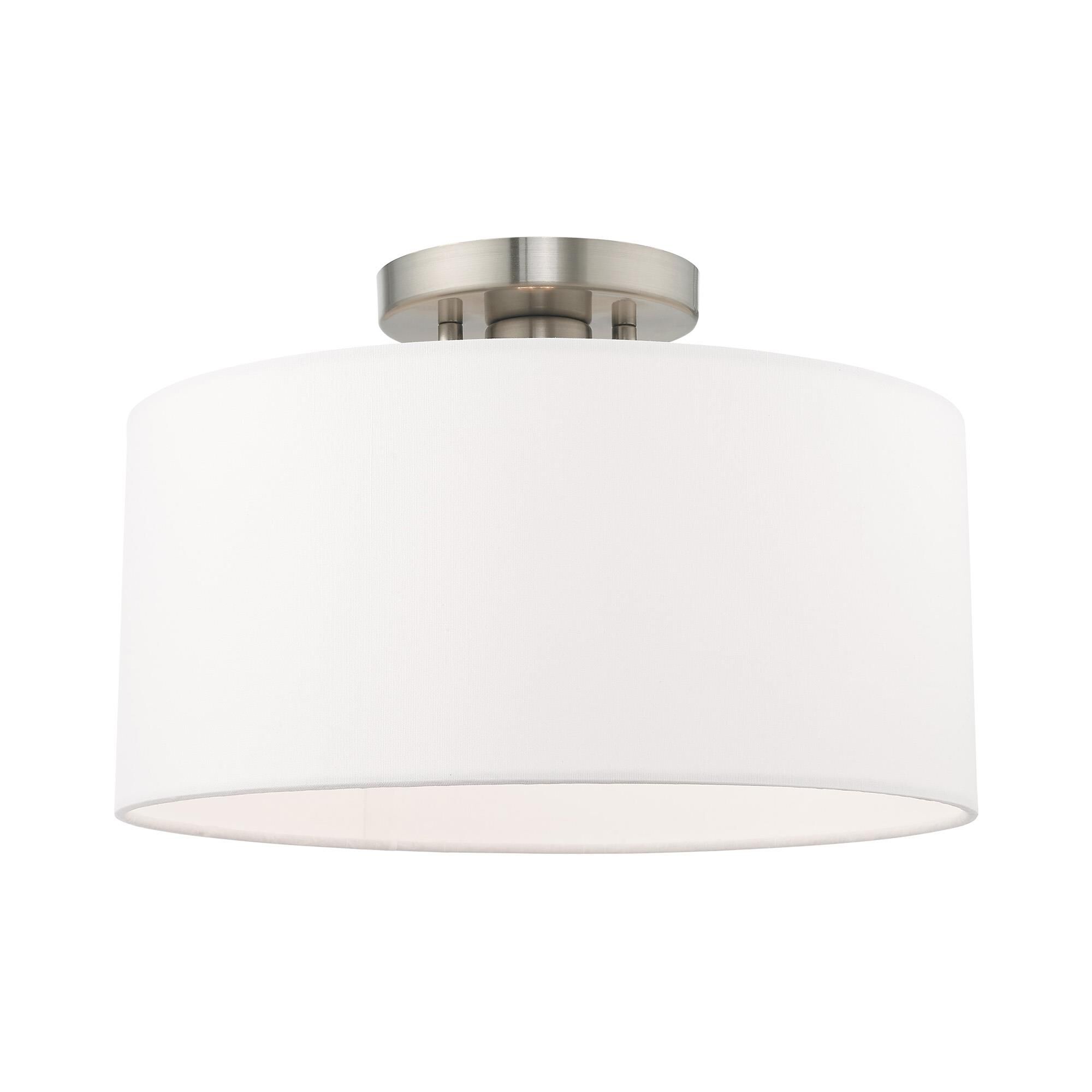 Shown in Brushed Nickel finish and Hand Crafted Off-White Fabric Hardback shade
