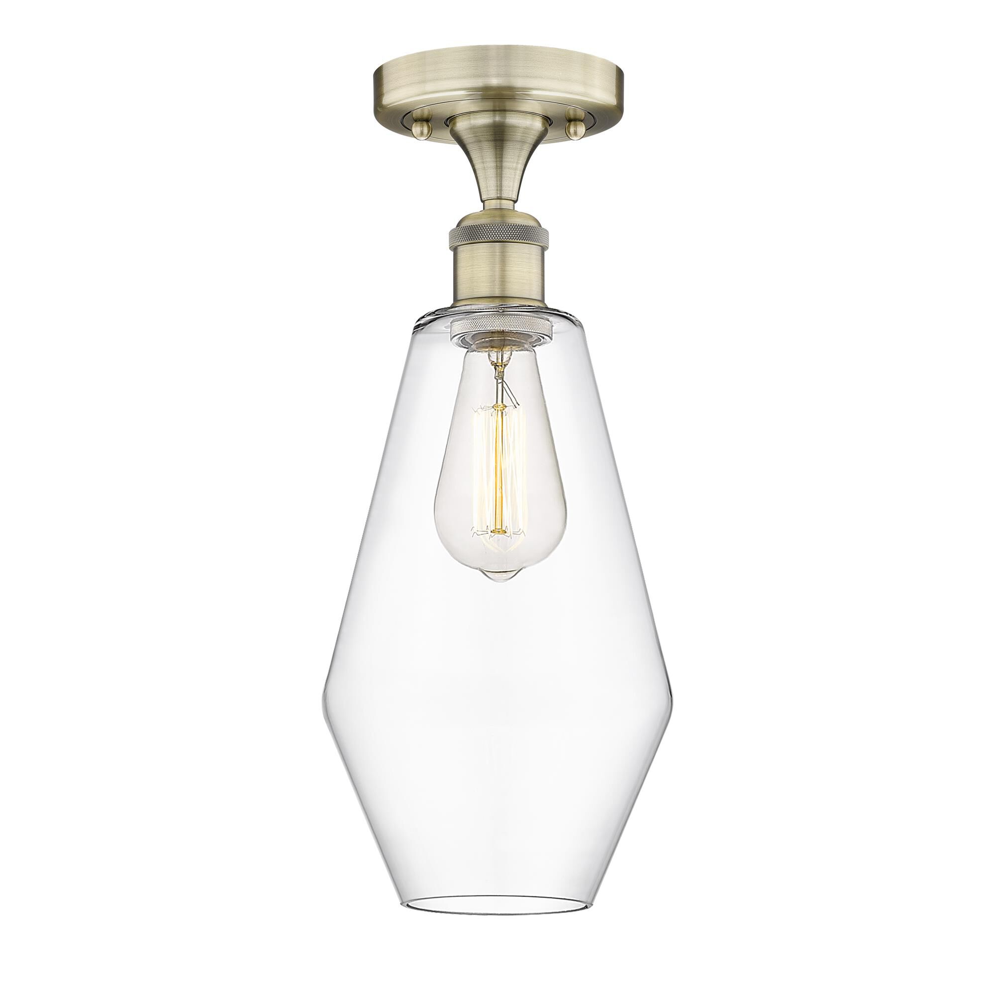 Shown in Antique Brass finish and Clear glass
