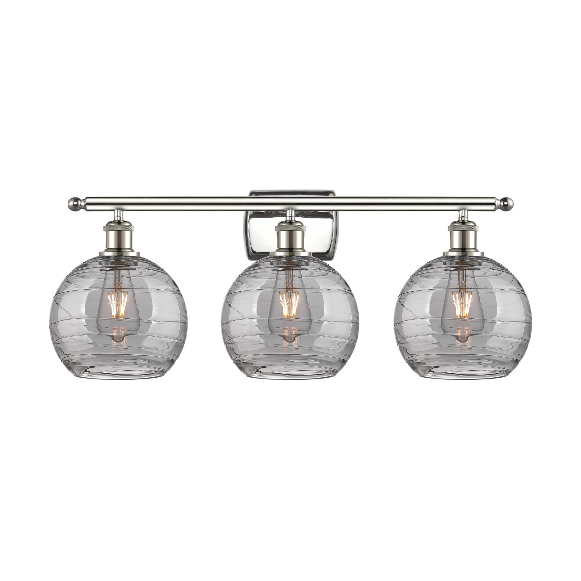 Shown in Polished Nickel finish and Light Smoke Deco Swirl glass