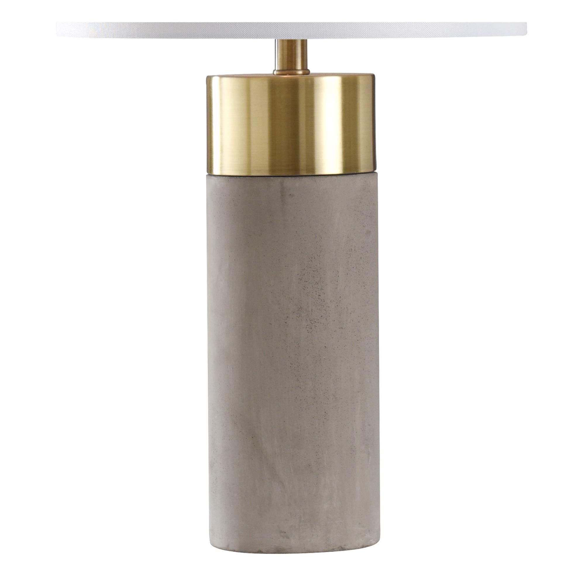 Shown in Soft Brass, Natural Concrete finish and Brussels White Hardback Fabric shade