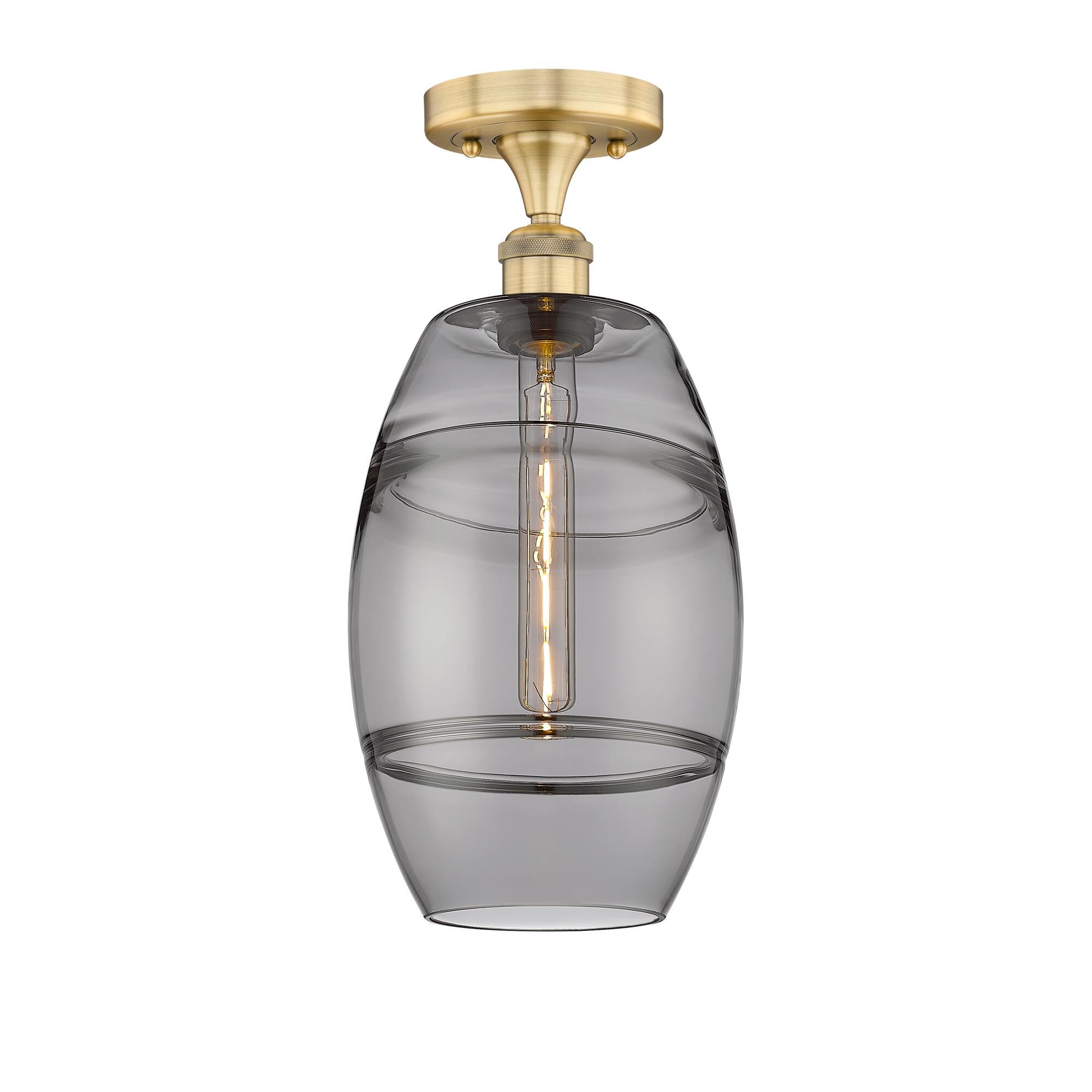 Shown in Brushed Brass finish and Light Smoke glass