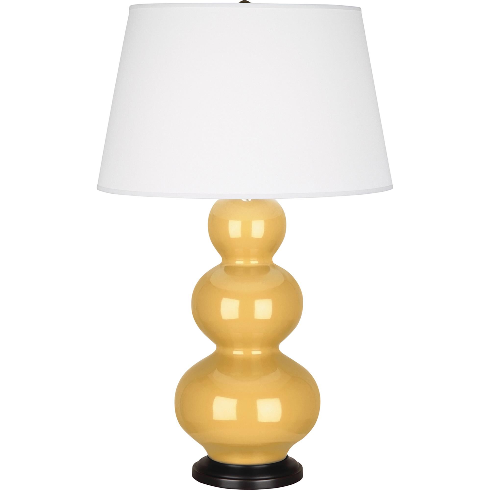 Shown in Sunset Yellow Glazed Ceramic With Deep Patina Bronze ed Accents finish and Pearl Dupioni Fabric shade