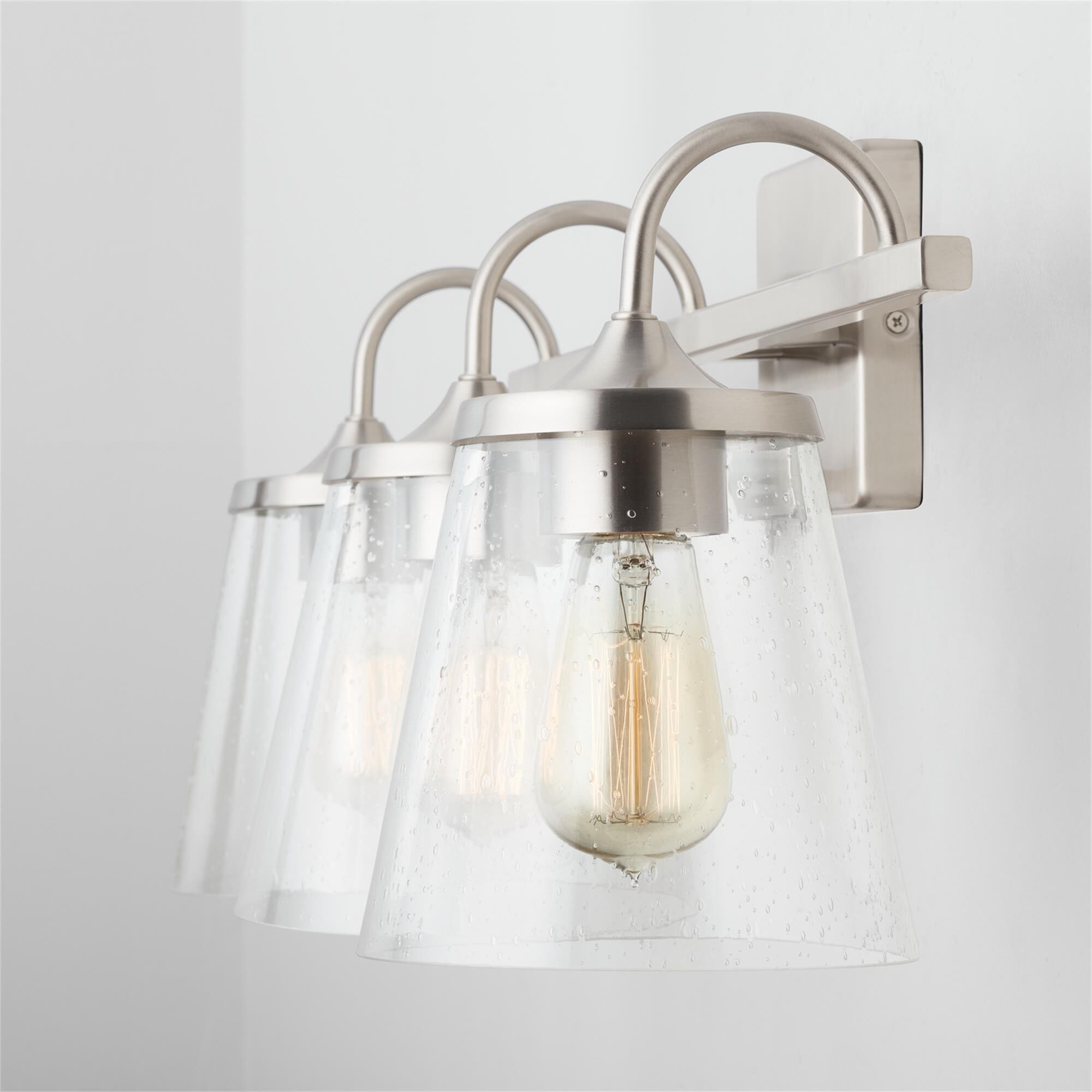 Shown in Brushed Nickel finish and Clear Seeded glass