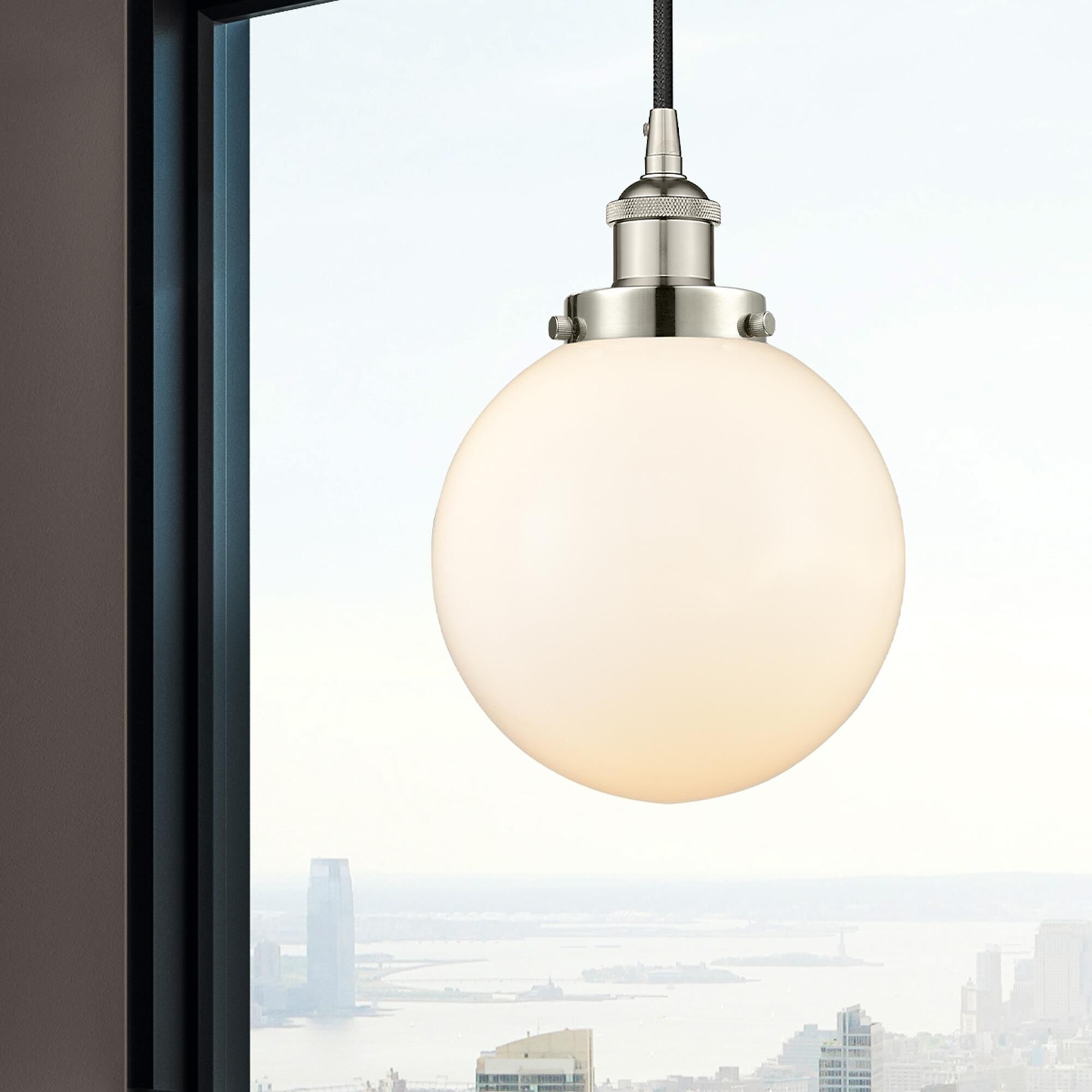 Shown in Polished Nickel finish and Matte White Cased Beacon glass