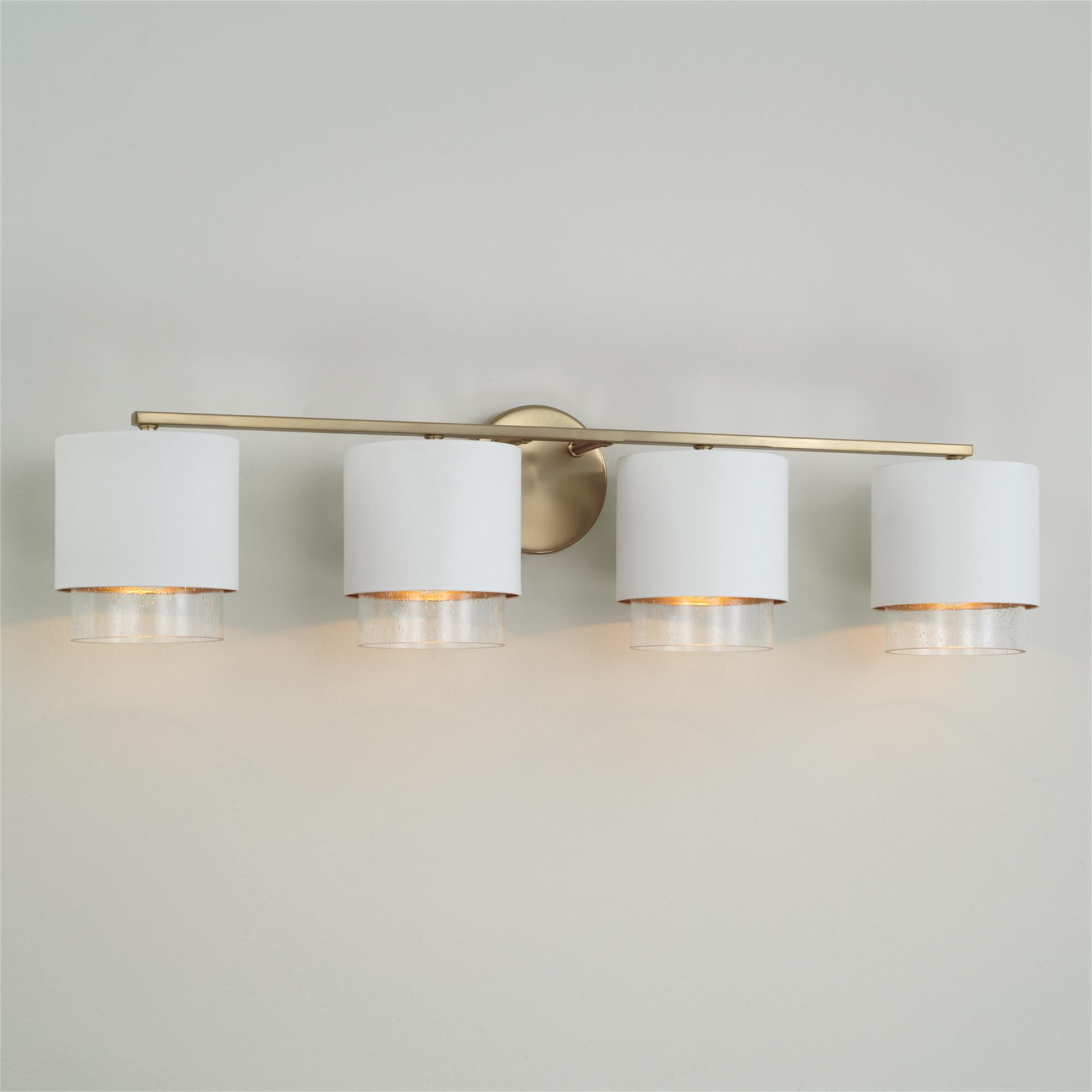 Shown in Matte Brass and White finish and Clear Seeded glass and Metal with Brass Interior shade