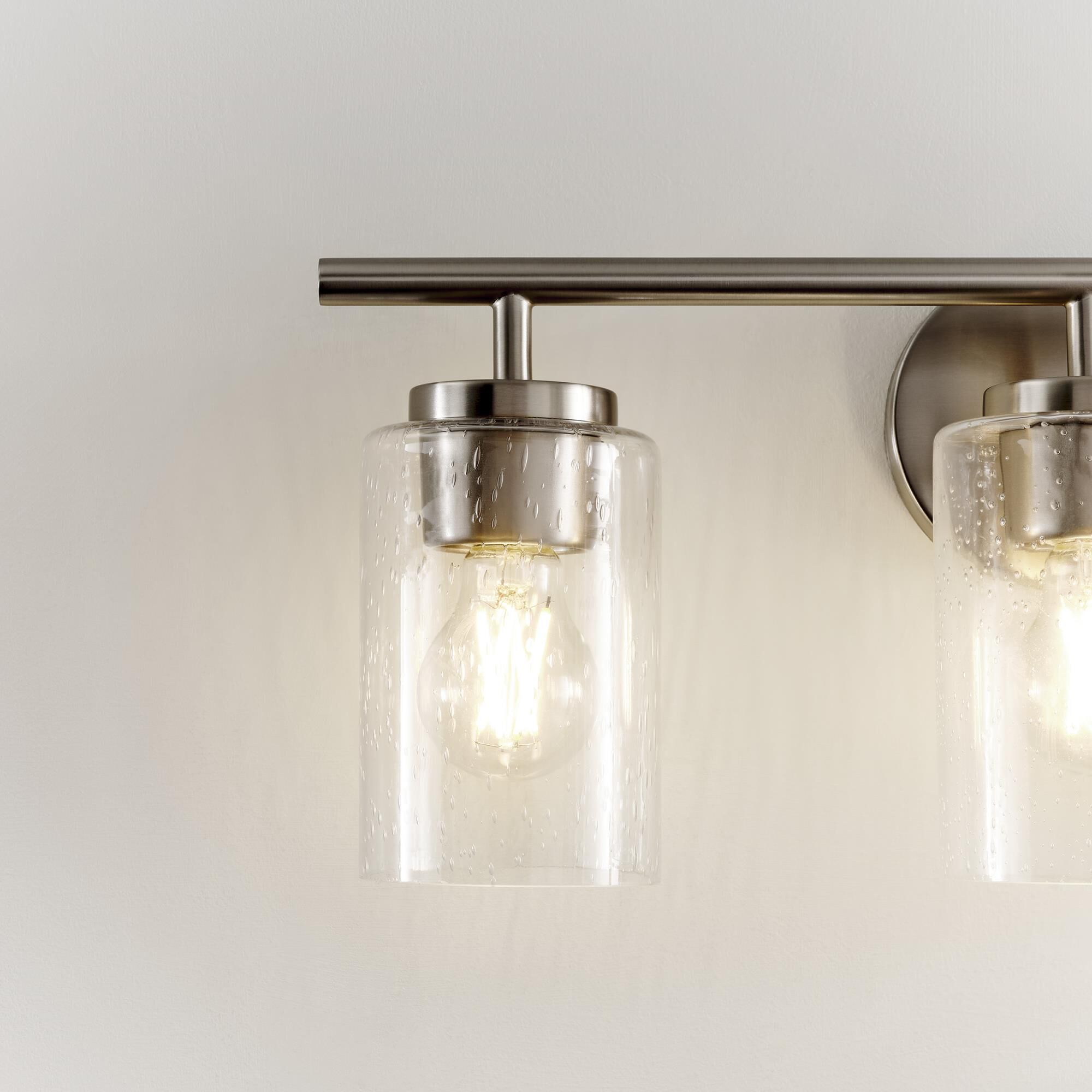 Shown in Brushed Nickel finish and Clear Seeded glass