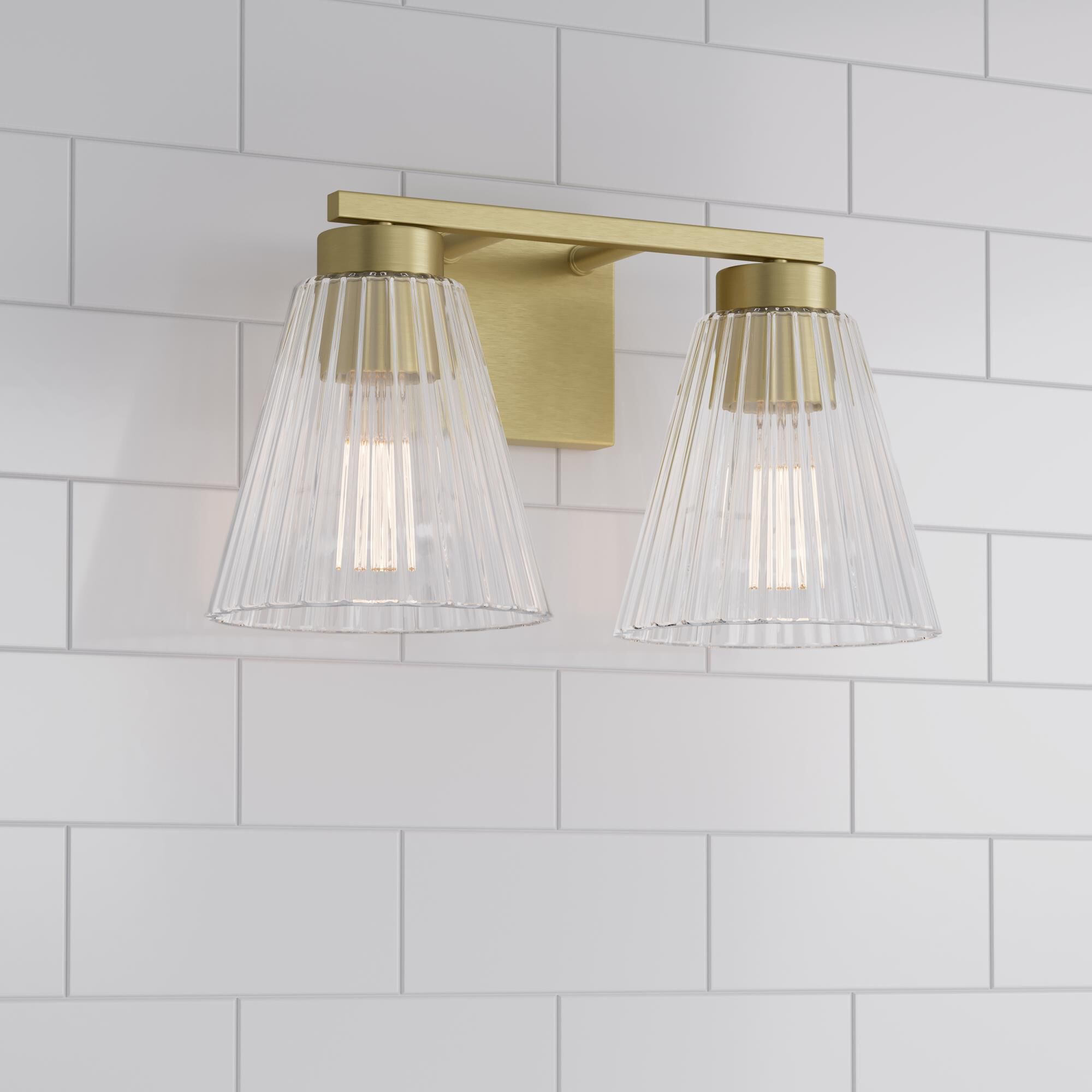 Shown in Vintage Brass finish and Clear Striated glass