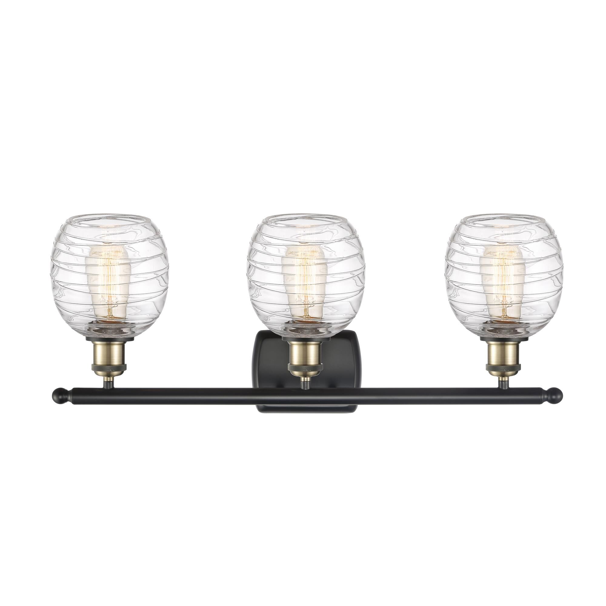 Shown in Black Antique Brass finish and Deco Swirl glass