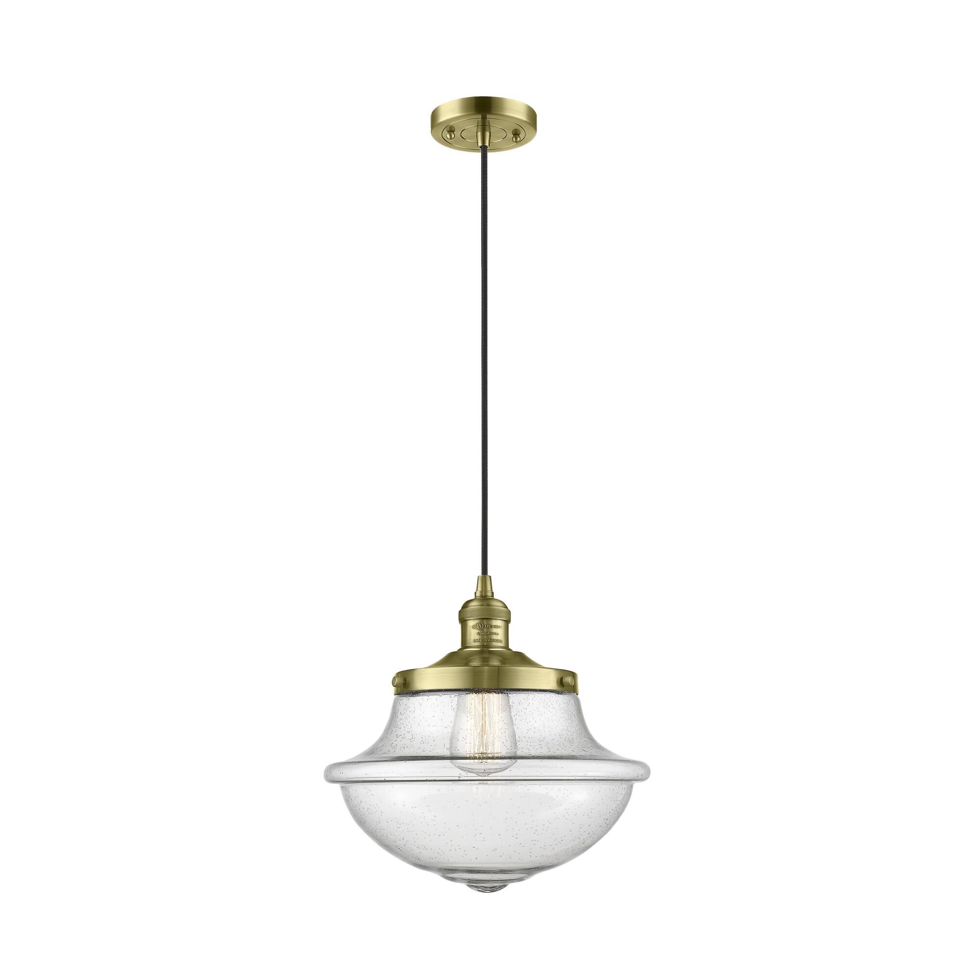 Shown in Antique Brass finish and Seedy glass