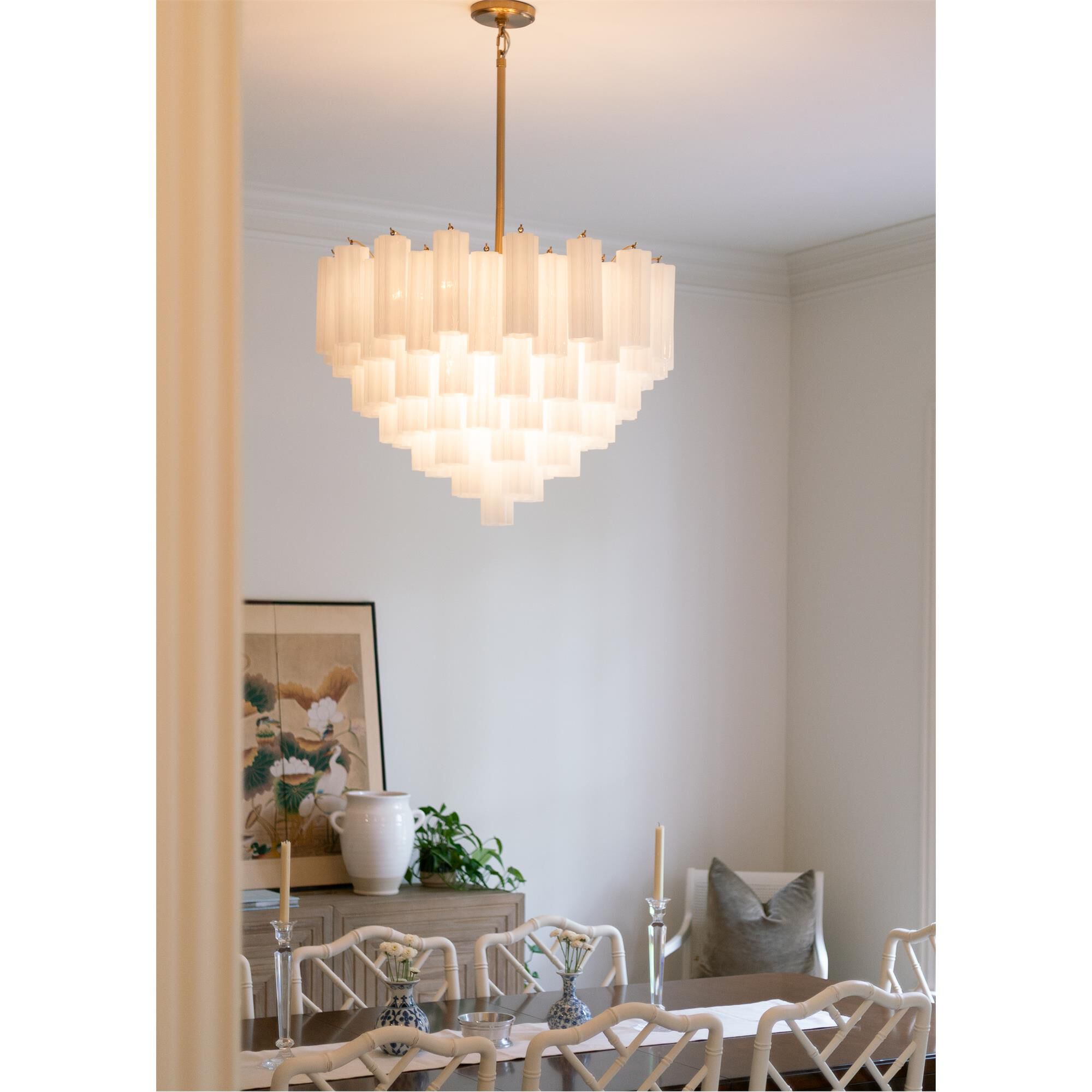 Shown in Aged Brass finish and Tronchi White glass