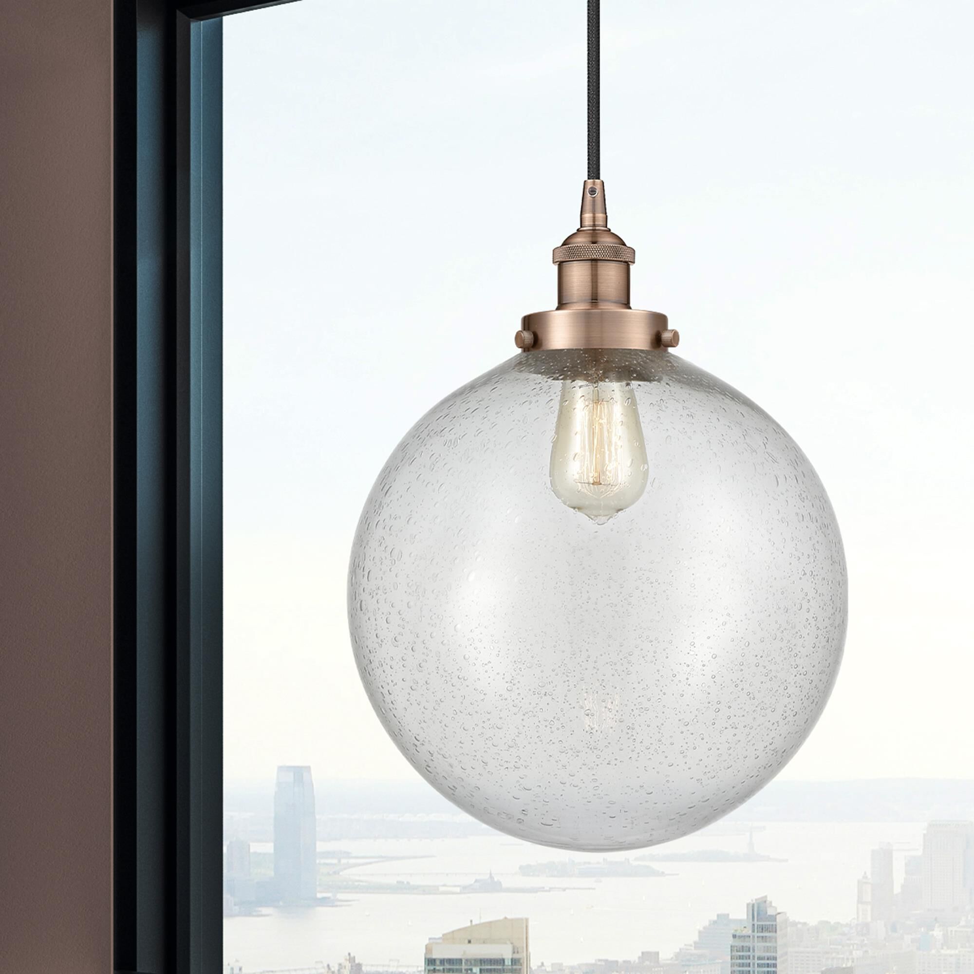Shown in Antique Copper finish and Seedy Beacon glass