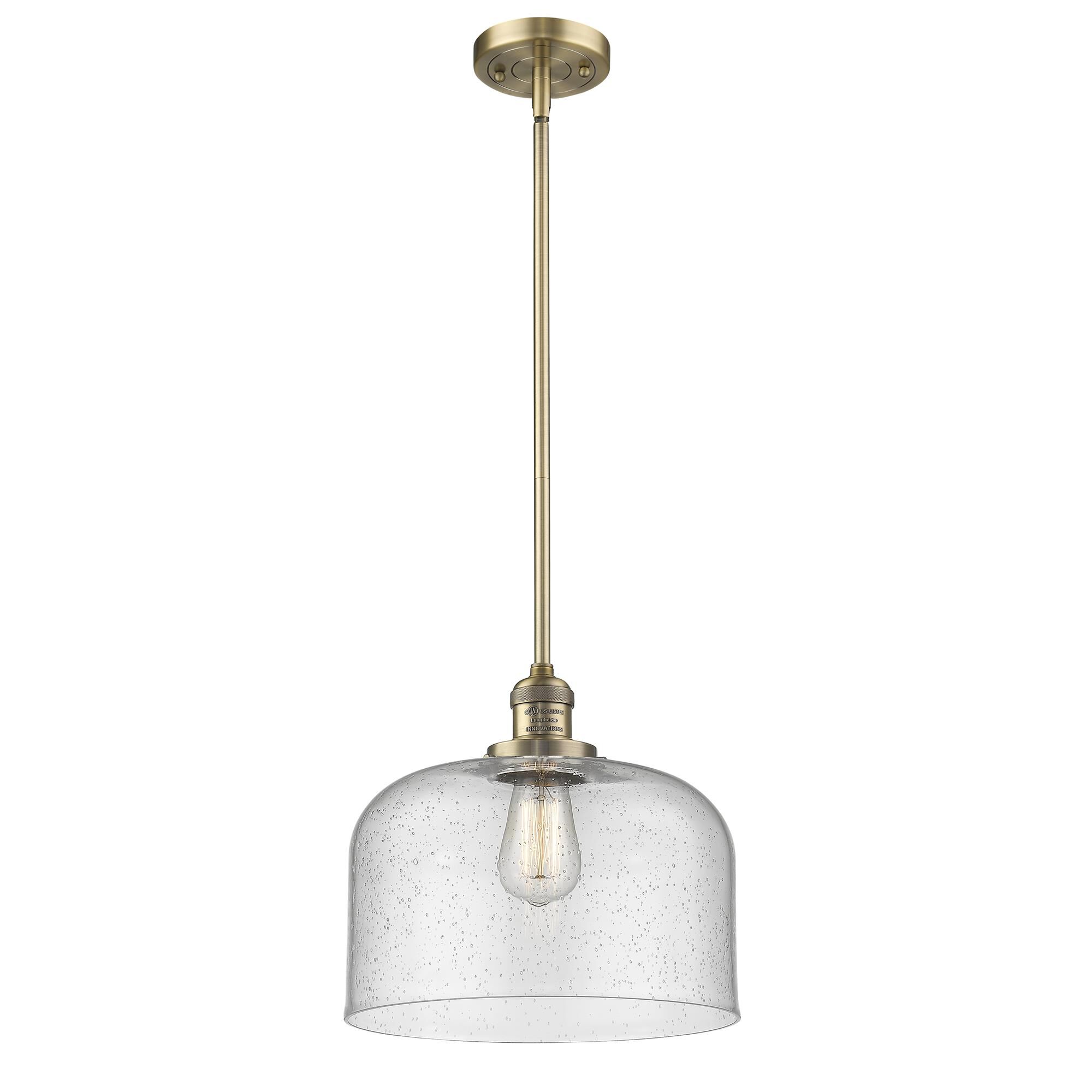 Shown in Brushed Brass finish and Seedy glass