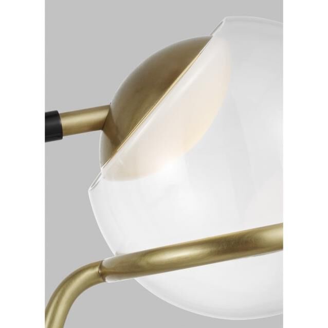 Shown in Glossy Black And Natural Brass finish and Glass shade