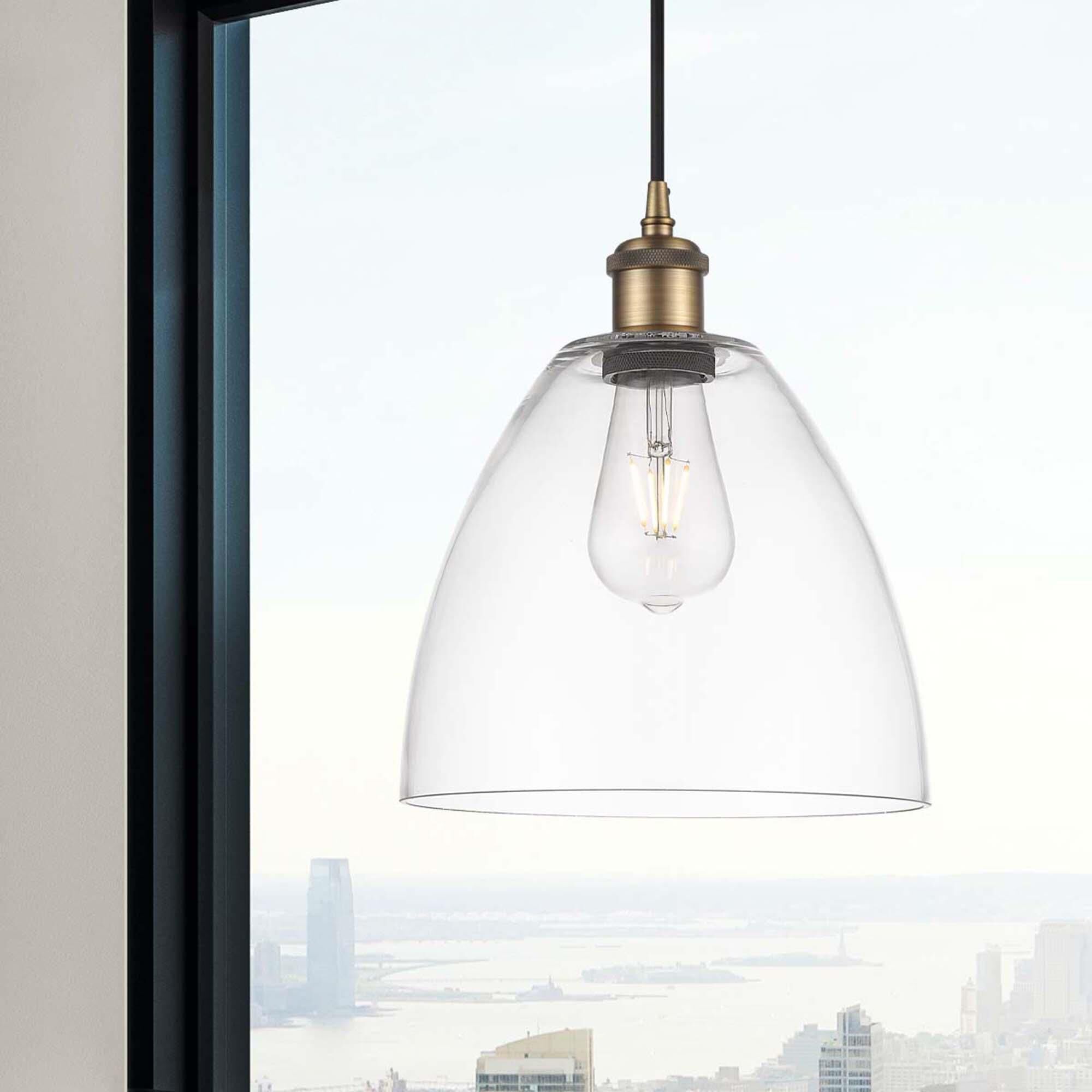 Shown in Brushed Brass finish and Cased Matte White glass