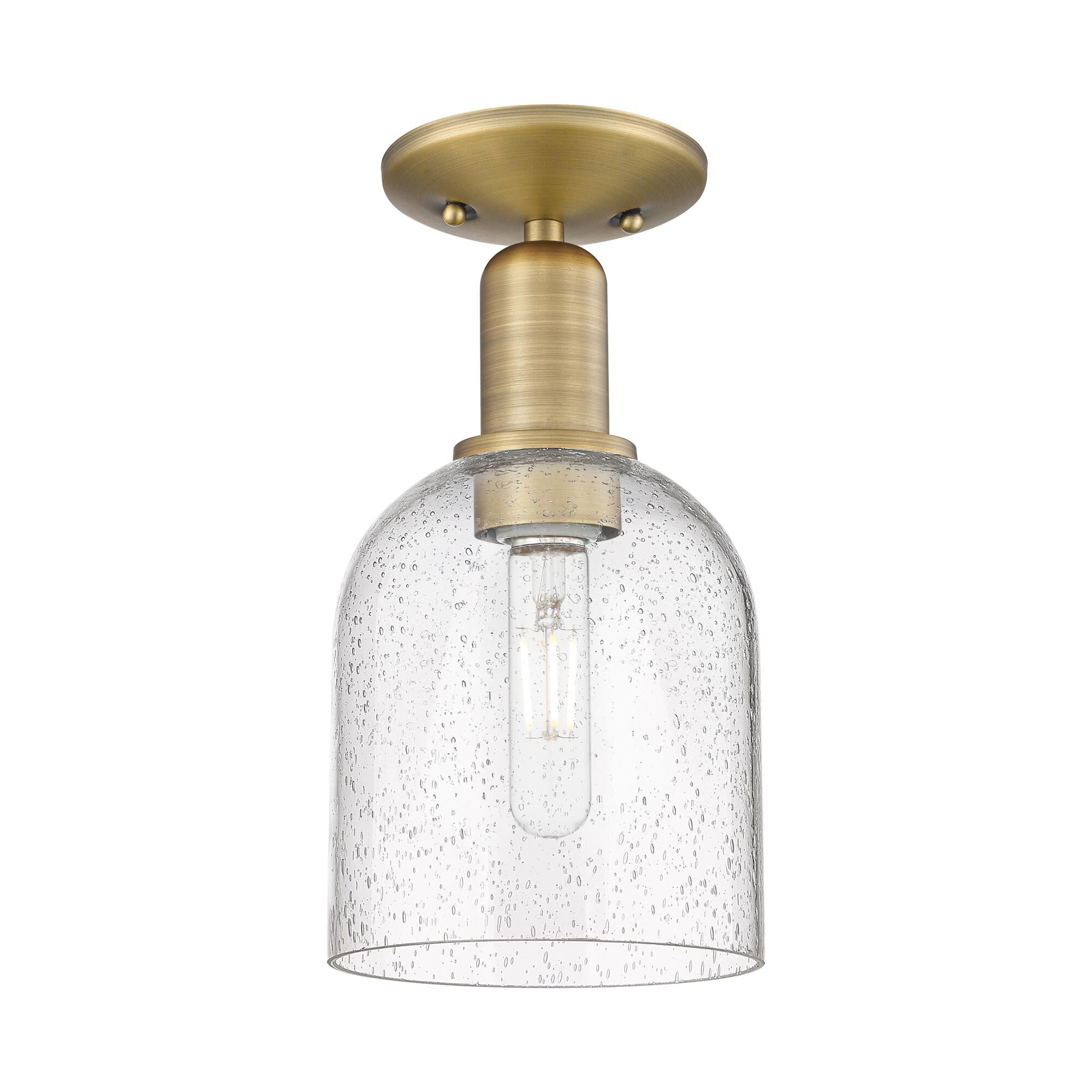 Shown in Brushed Brass finish and Seedy glass