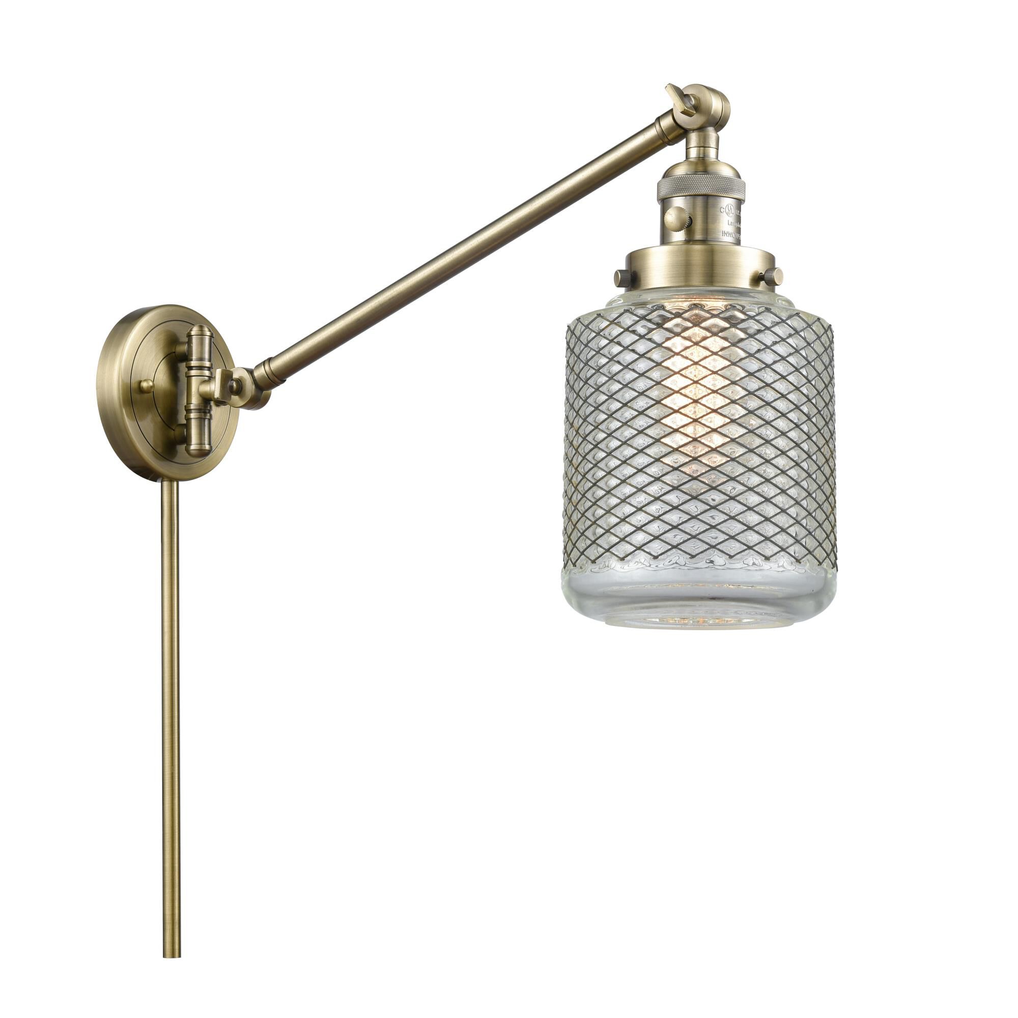 Shown in Antique Brass finish and Clear Wire Mesh glass