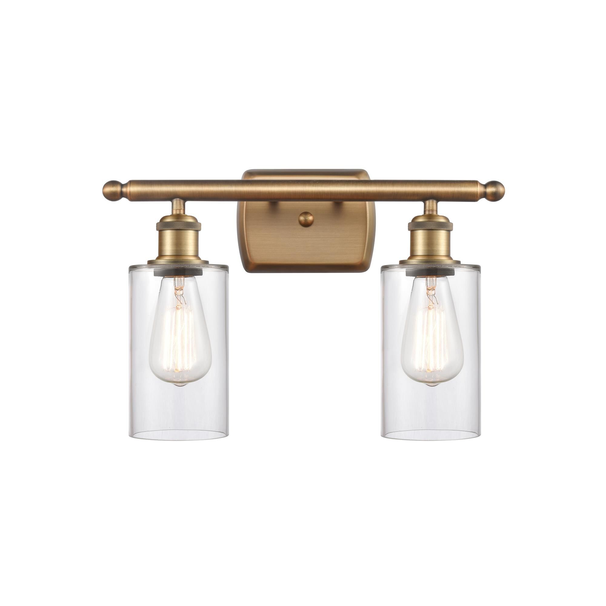 Shown in Brushed Brass finish and Drum glass and Glass shade and Polished Chrome accent