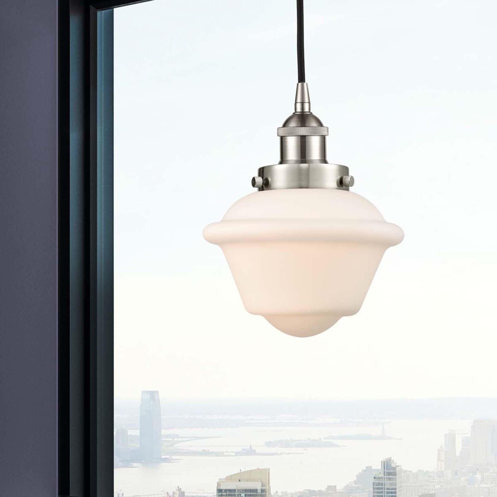 Shown in Brushed Satin Nickel finish and Matte White Cased Small Oxford glass