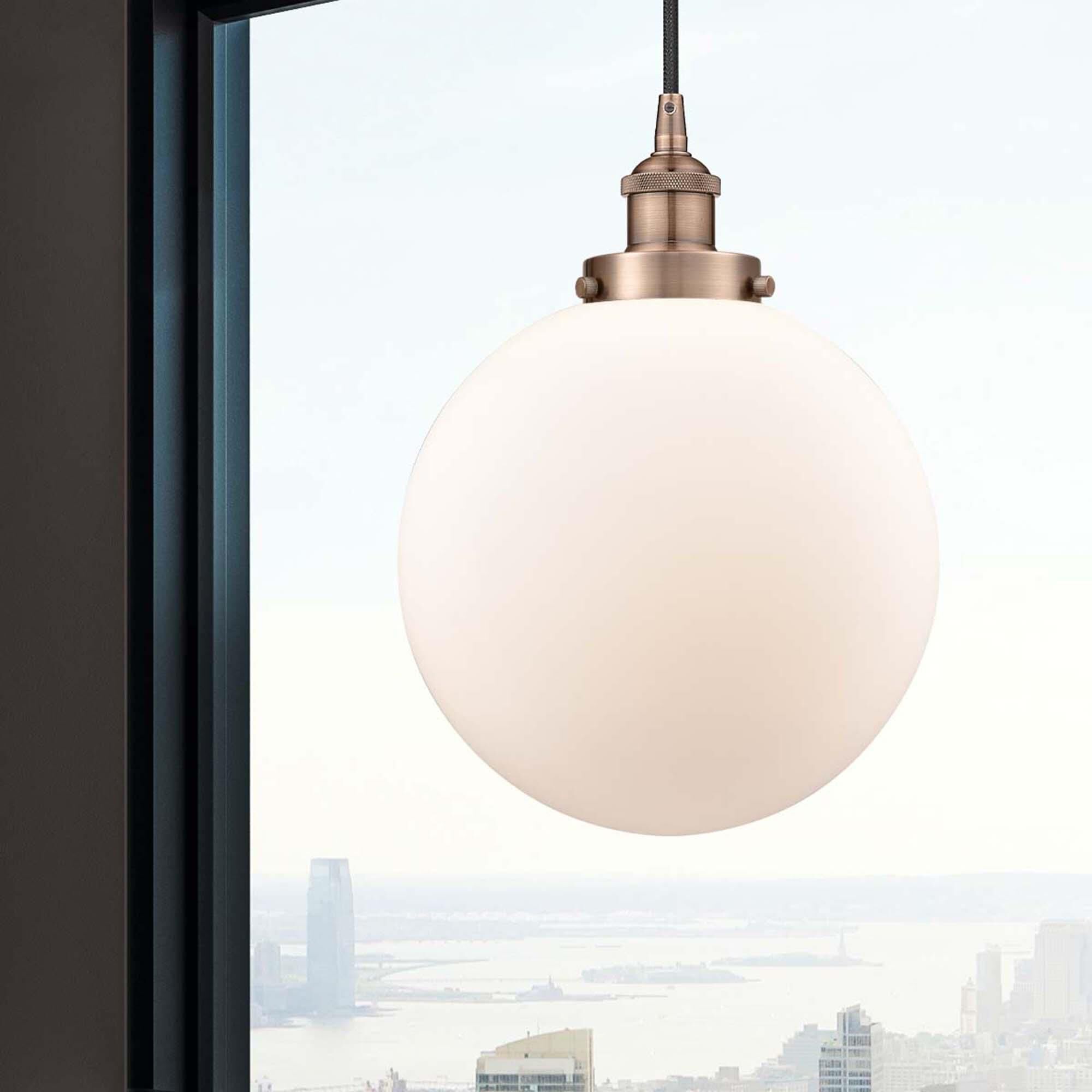 Shown in Antique Copper finish and Matte White Cased Beacon glass