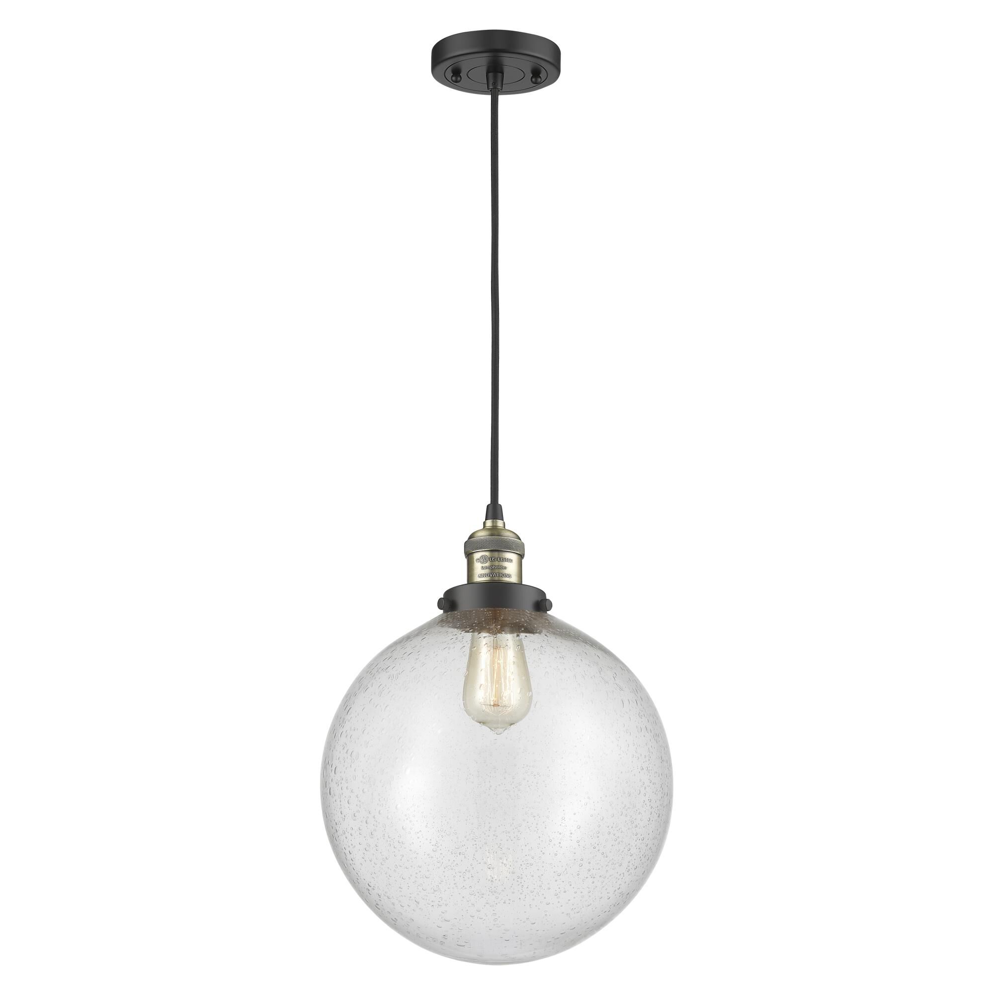 Shown in Black Antique Brass finish and Seedy Beacon glass