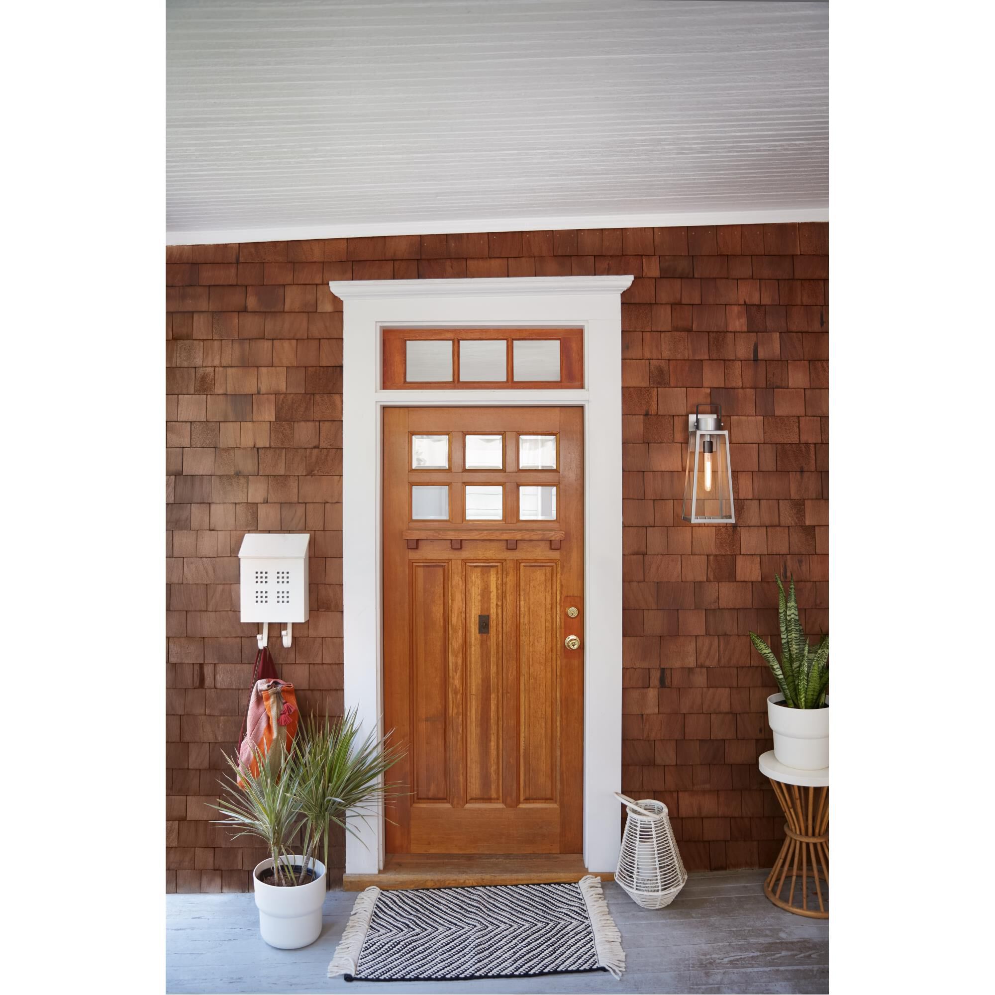 Shown in Antique Brushed Aluminum finish and Clear glass and Black accent