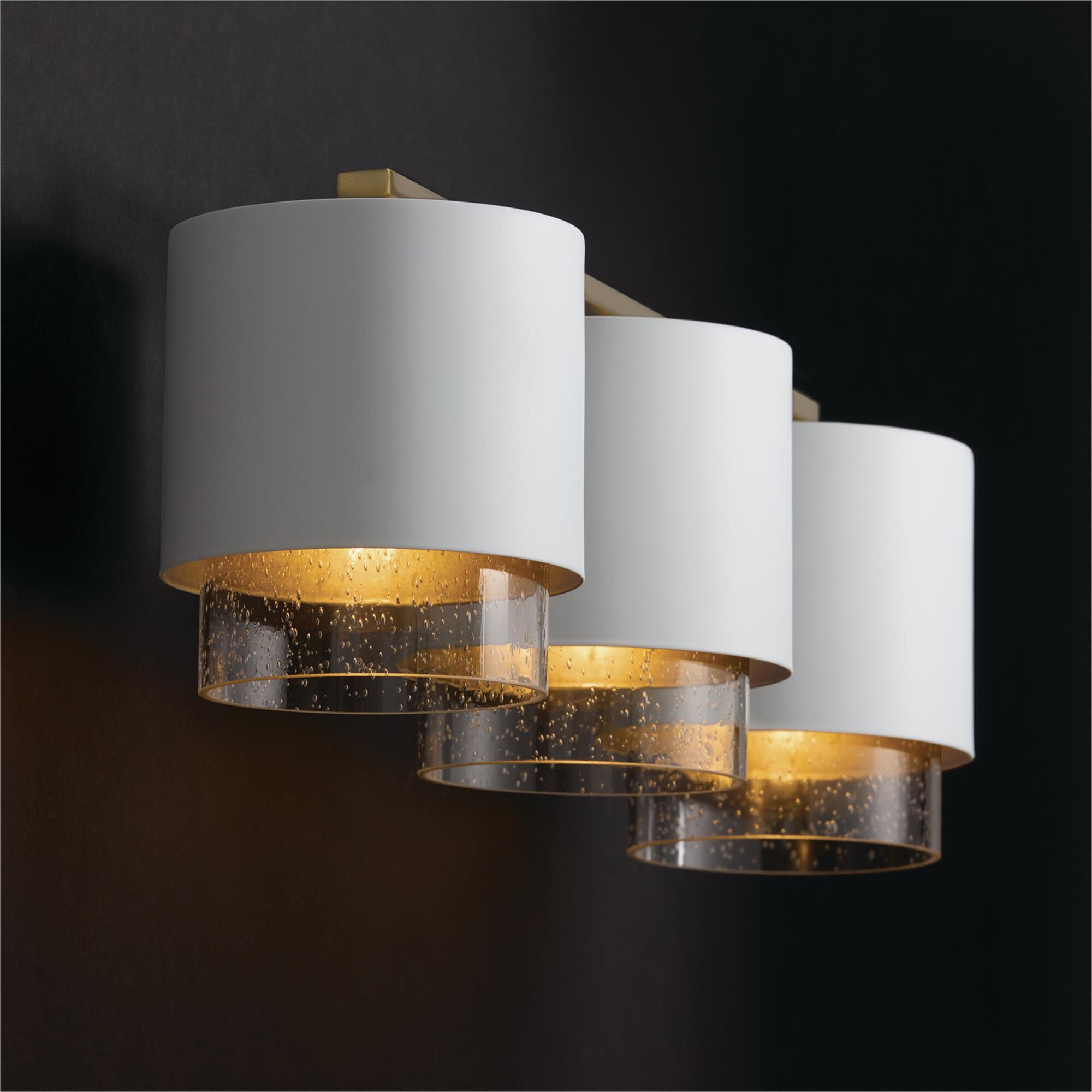 Shown in Matte Brass and White finish and Clear Seeded glass and Metal with Brass Interior shade