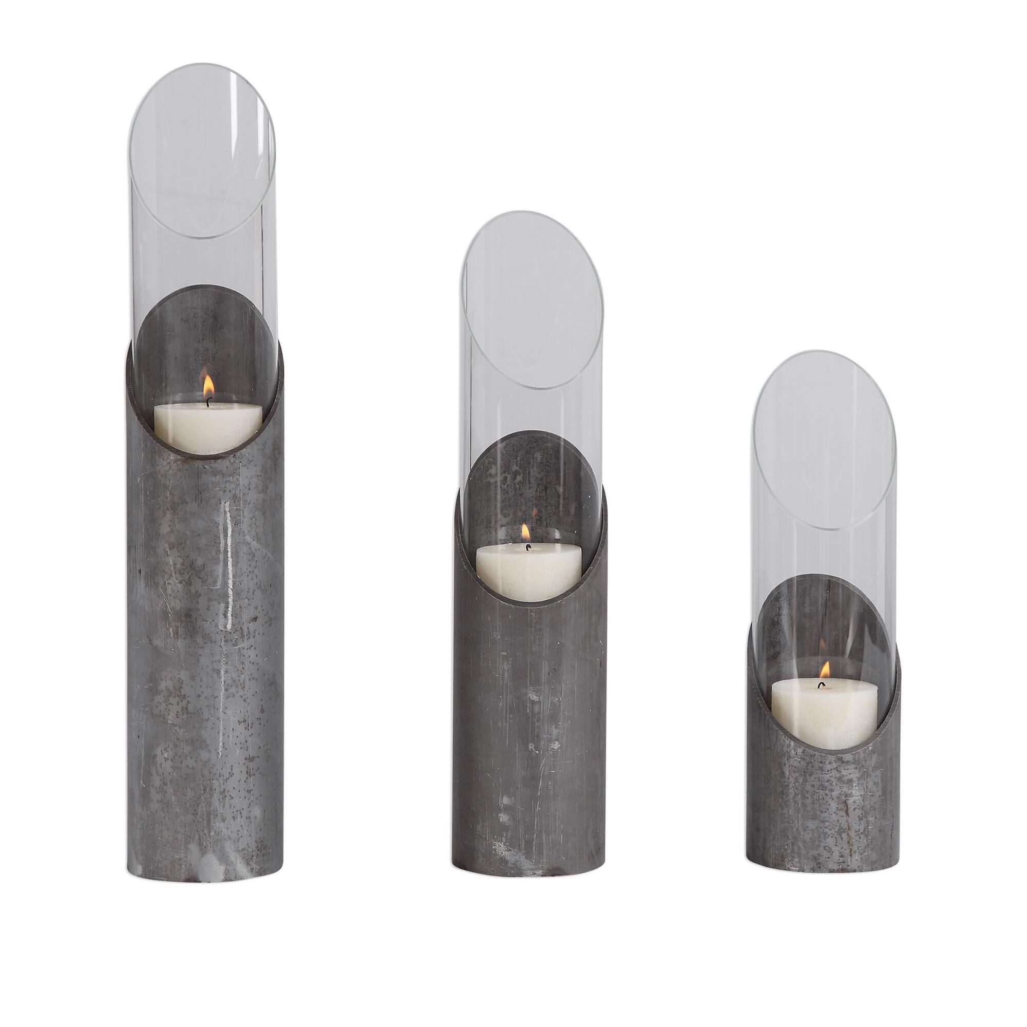 Shown in This Set Of Three Candleholders Features A Sleek Angular Design In Raw Iron And Clear Glass Cylinder finish