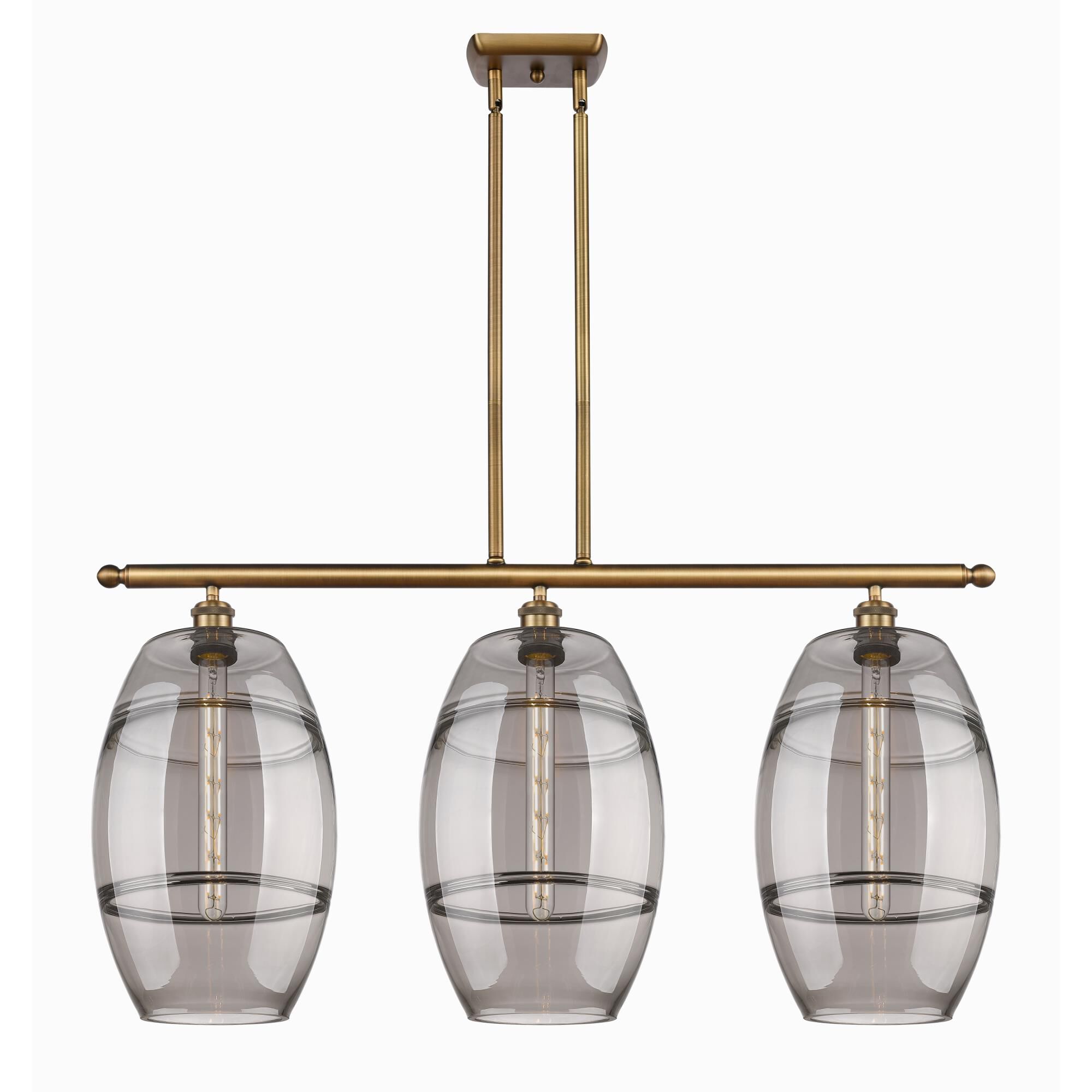Shown in Brushed Brass finish and Light Smoke glass