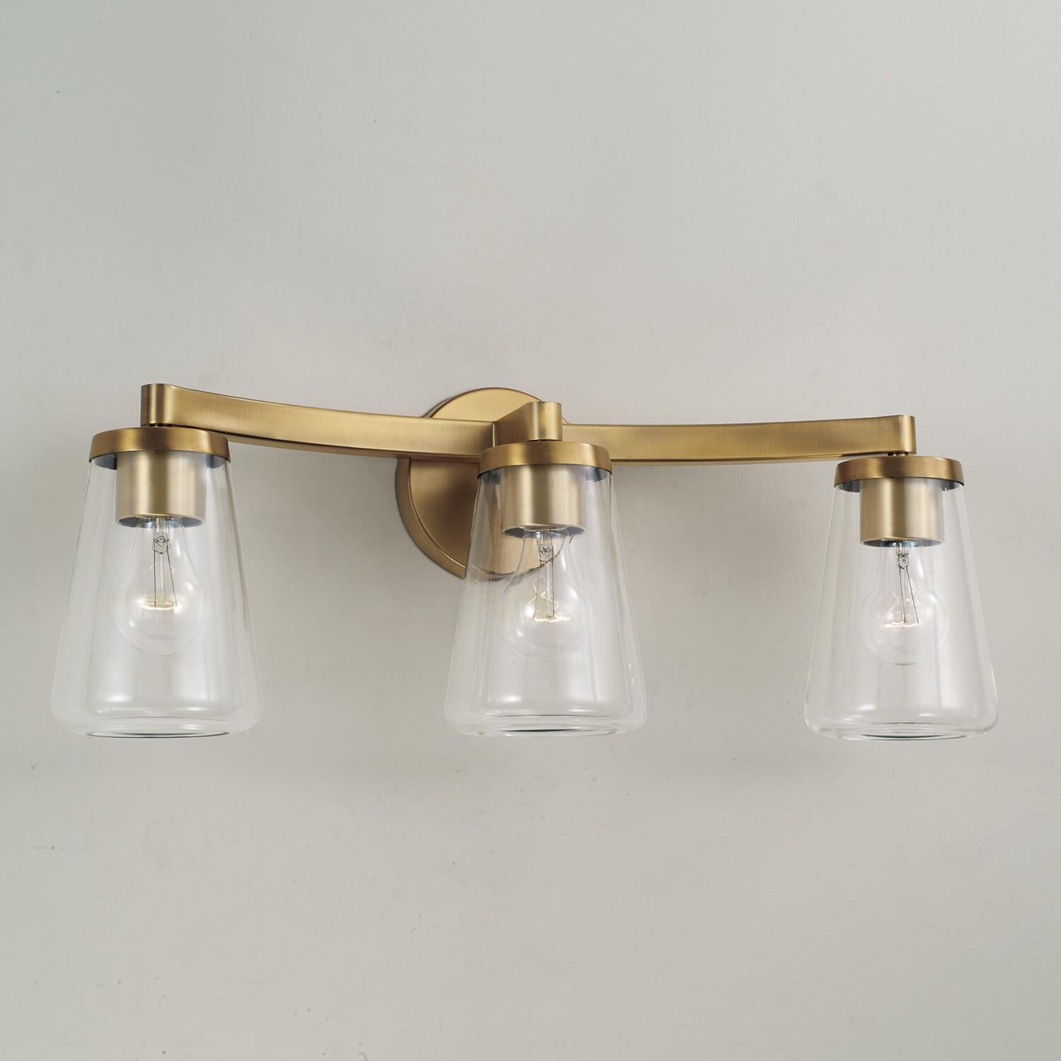 Shown in Aged Brass finish and Clear glass