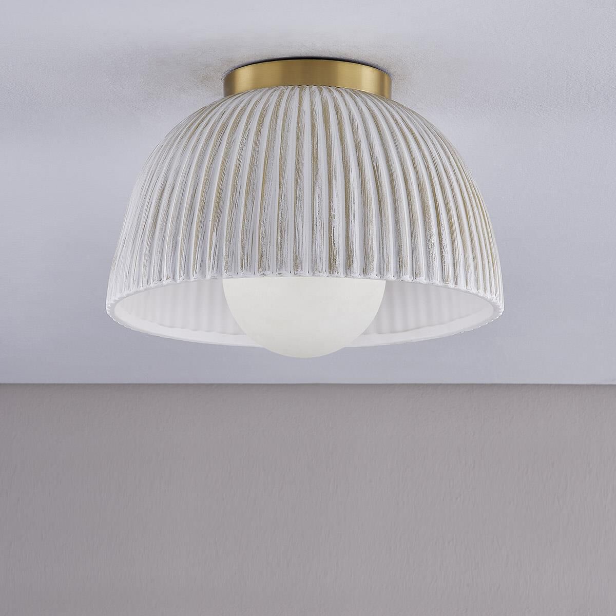 Shown in Aged Brass finish and Ceramic glass