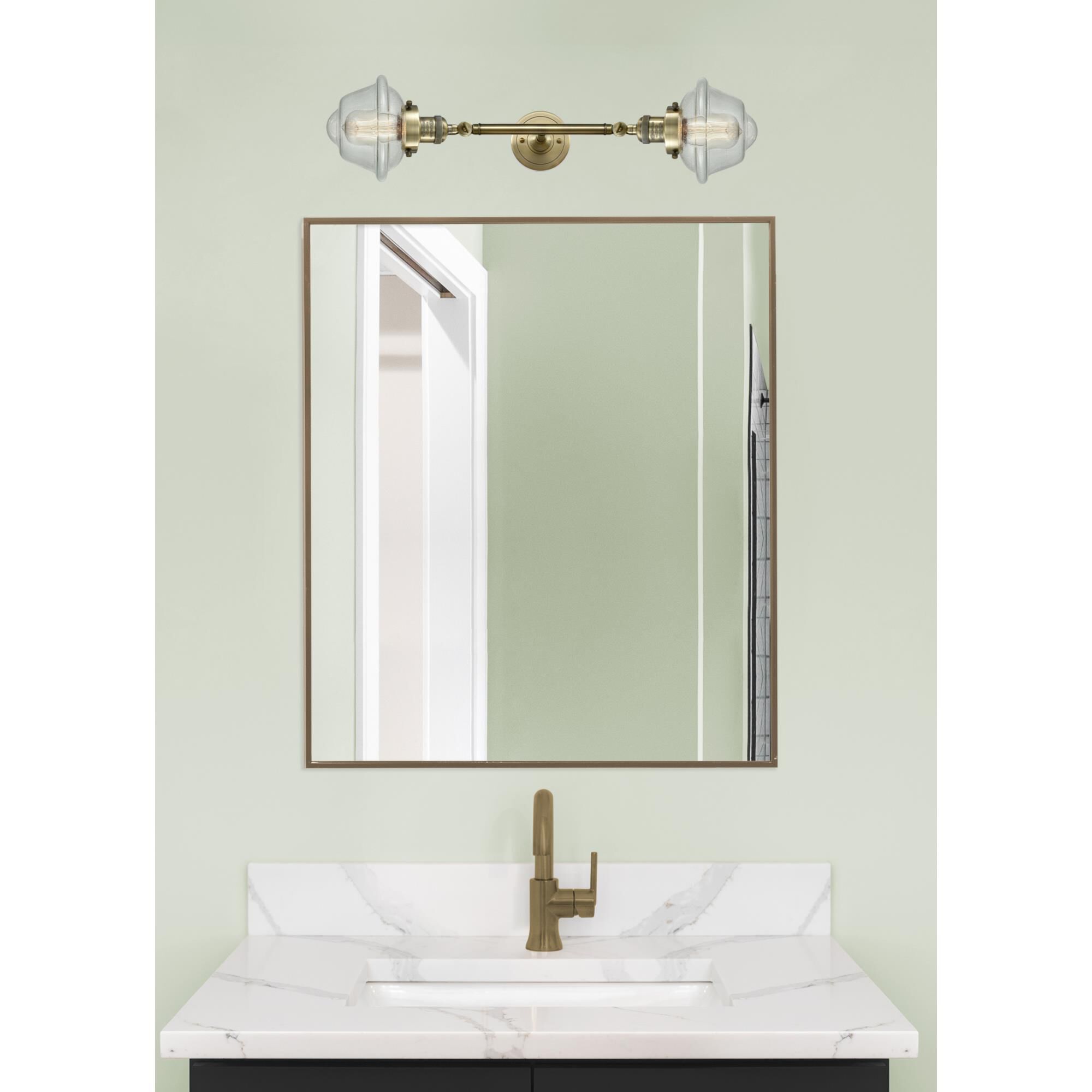 Shown in Antique Brass finish and Seedy glass