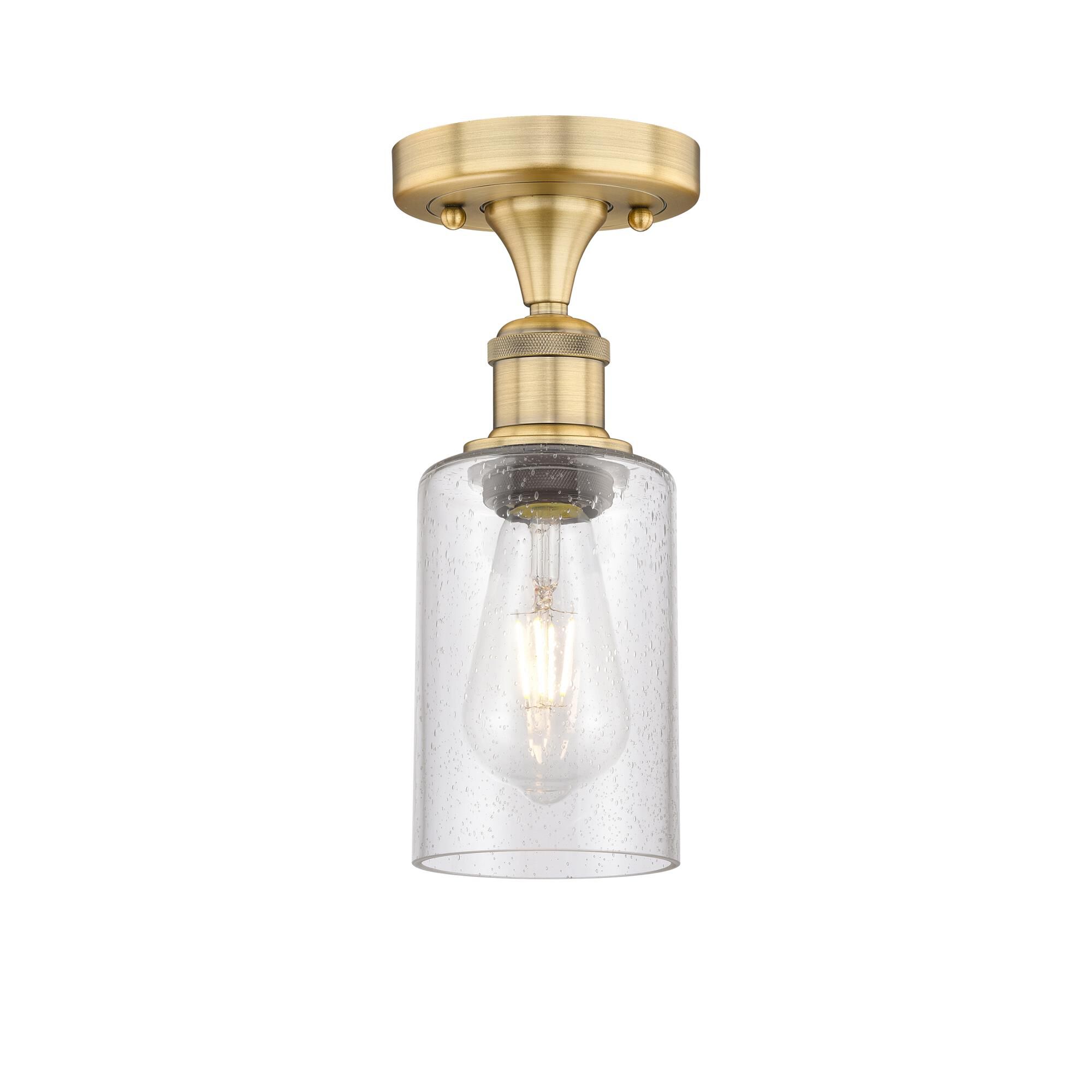 Shown in Brushed Brass finish and Seedy glass