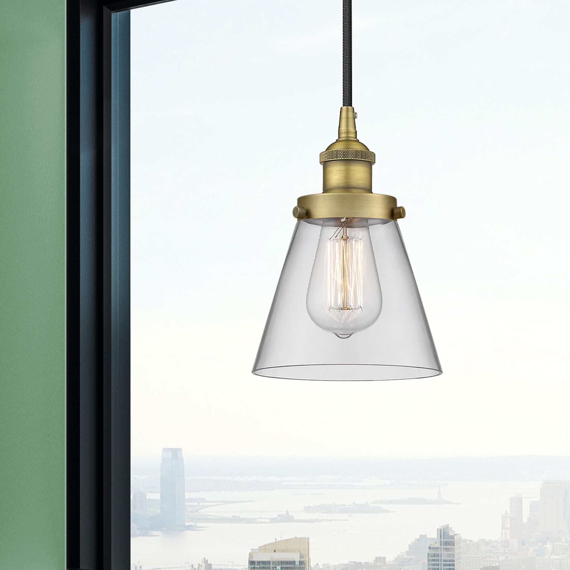 Shown in Brushed Brass finish and Clear Small Cone glass