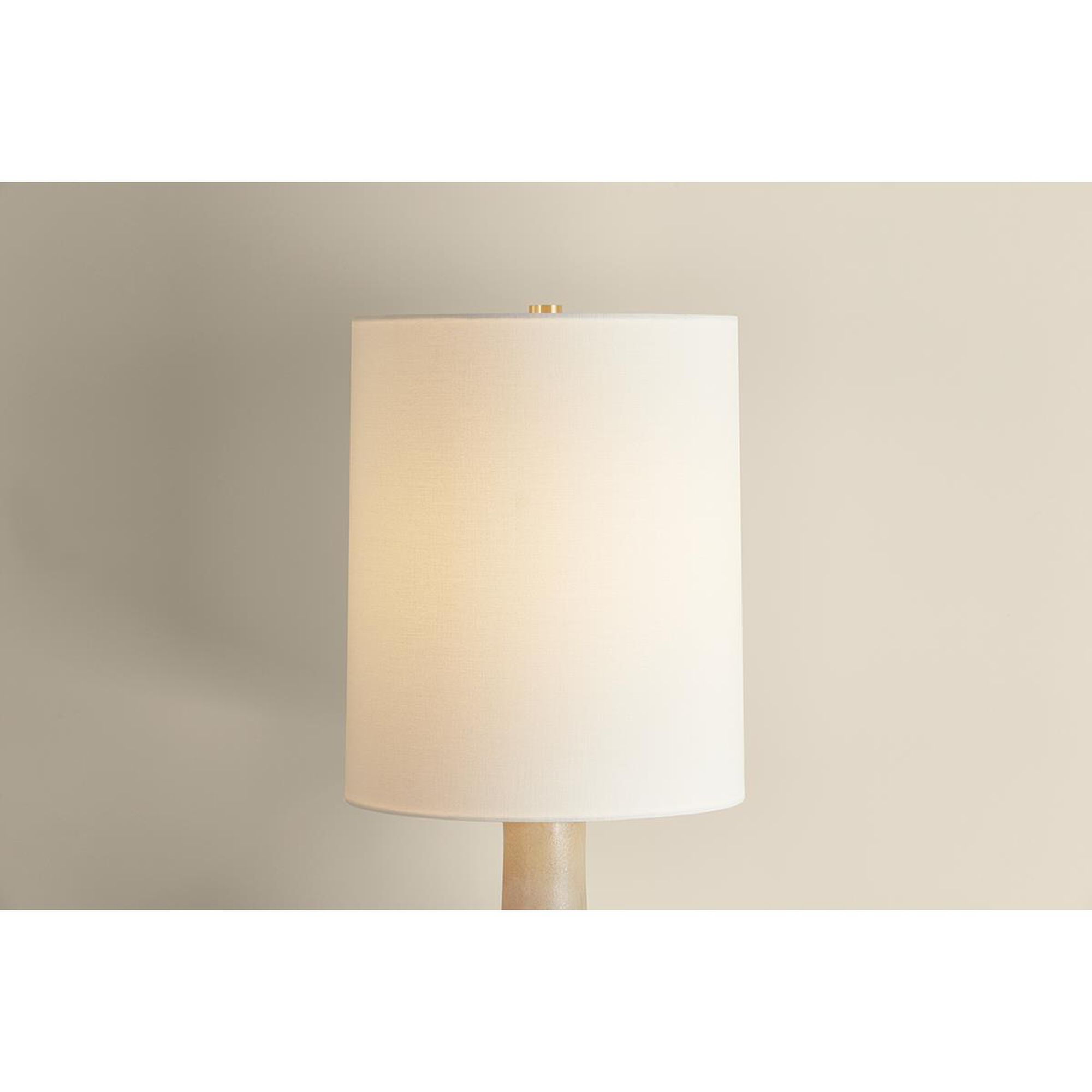Shown in Aged Brass and Ceramic Biscotti Reactive finish and Textured Linen shade