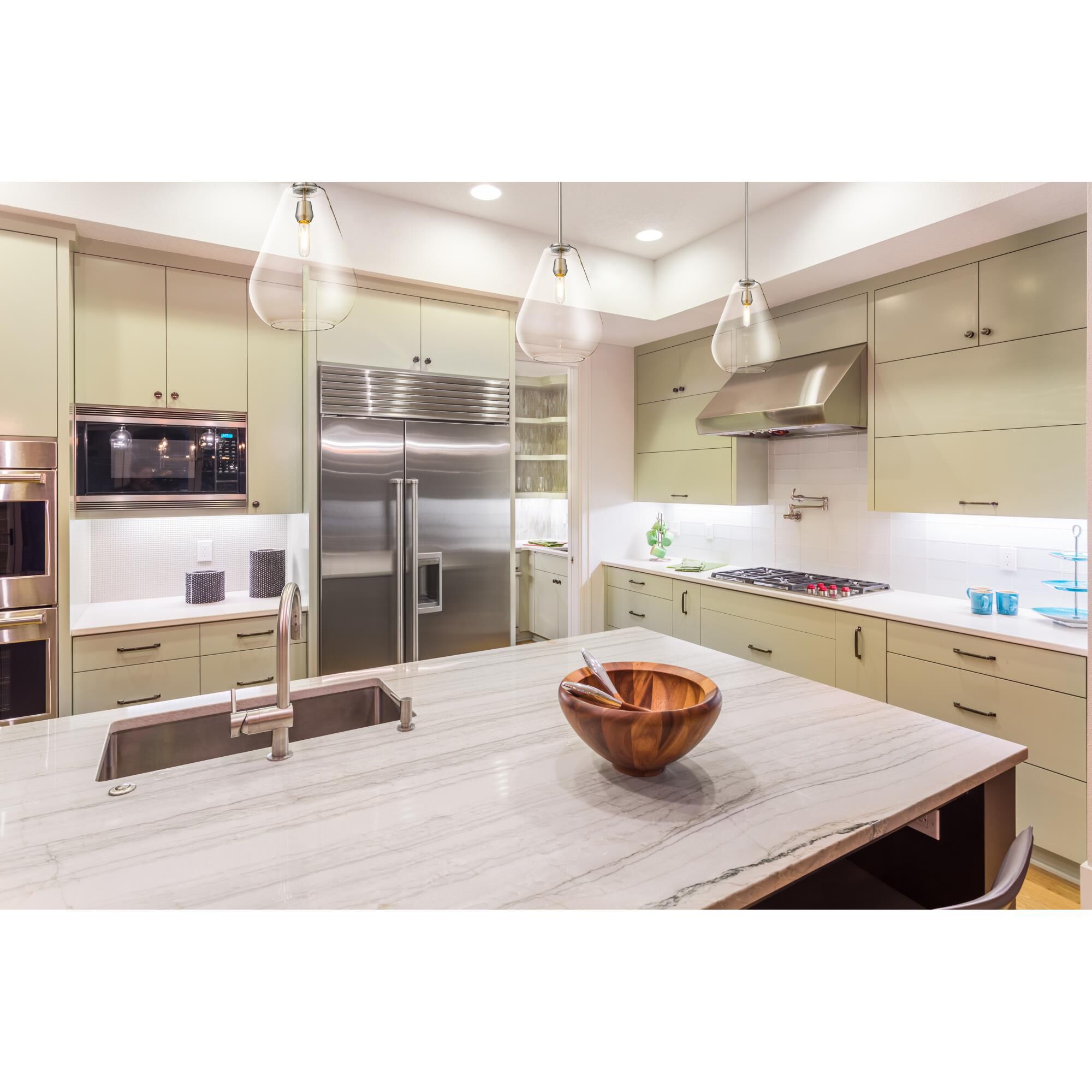 Shown in Brushed Nickel finish and Glass shade