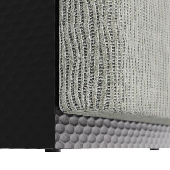 Close-up detail of the woven texture on the ottoman fabric.
