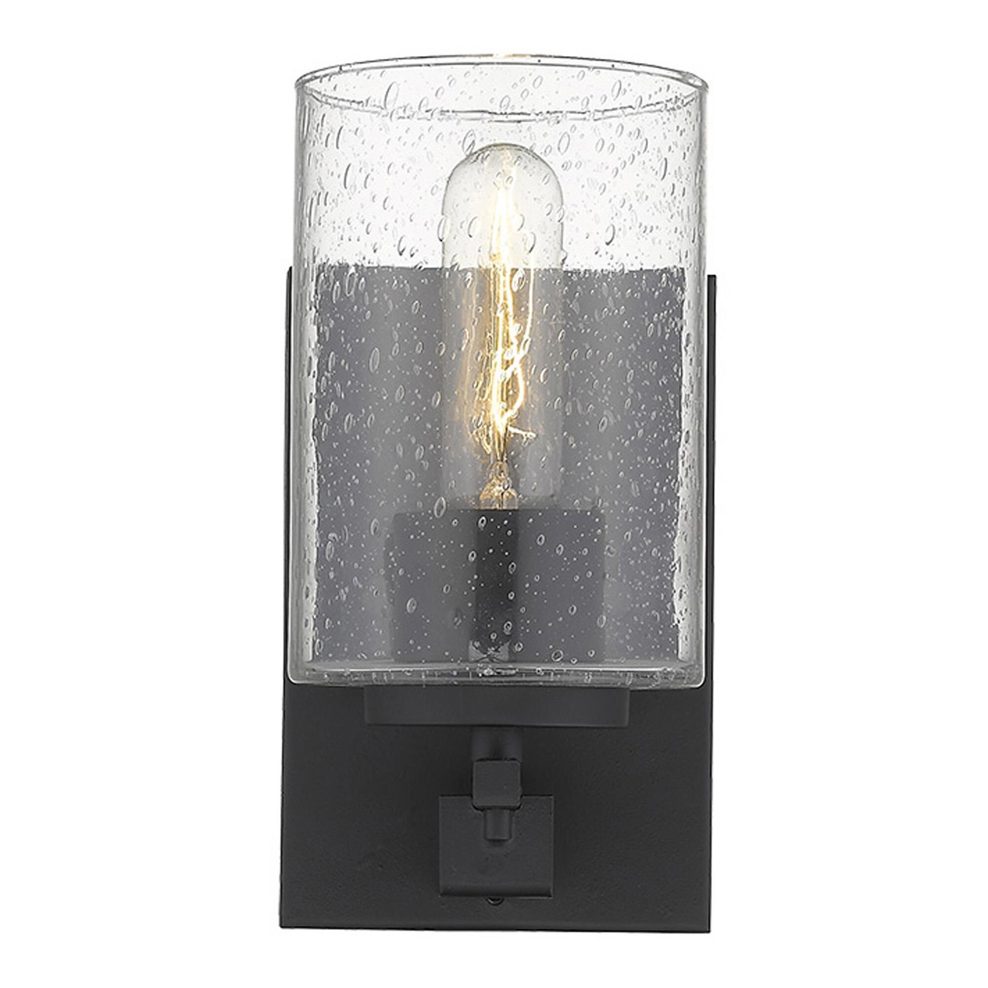 Shown in Matte Black finish and Clear glass and Clear, Seeded Cylindrical Glass shade