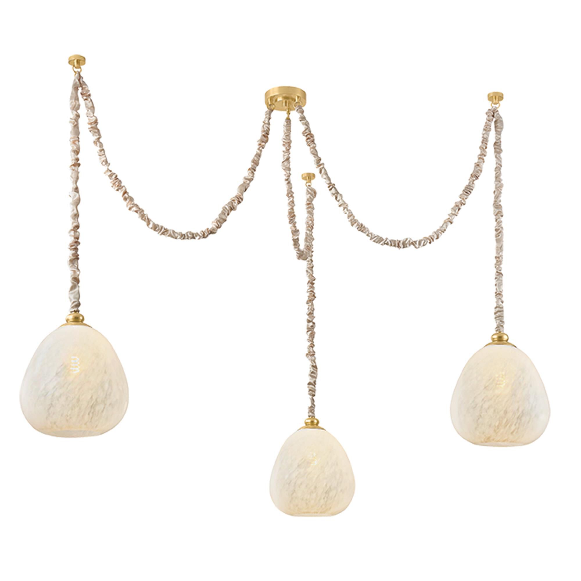 Shown in Aged Brass finish and Clear Cloud glass