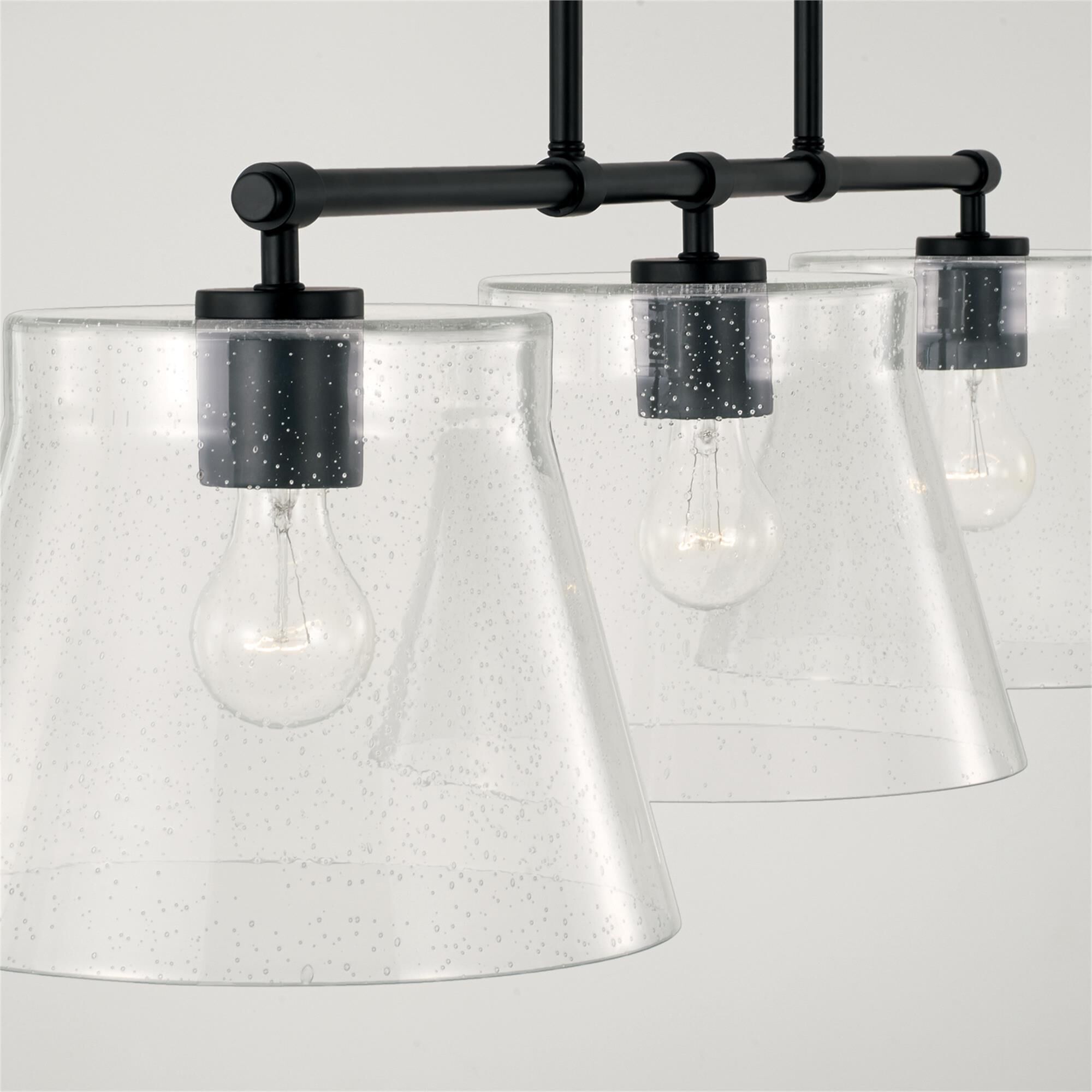 Shown in Matte Black finish and Clear Seeded glass