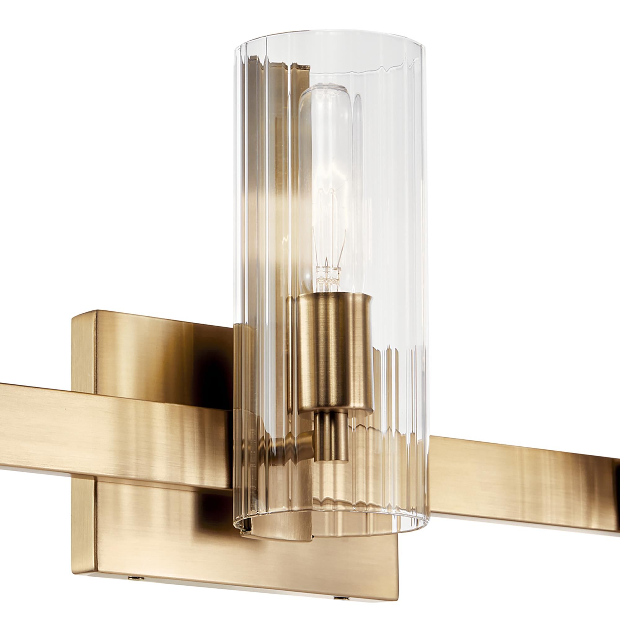 Shown in Champagne Bronze finish and Clear Fluted glass