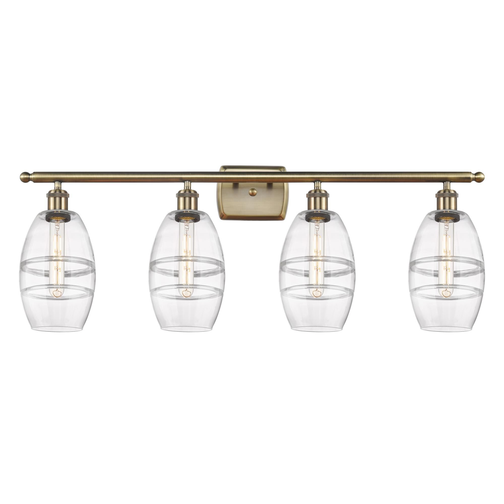 Shown in Antique Brass finish and Clear glass