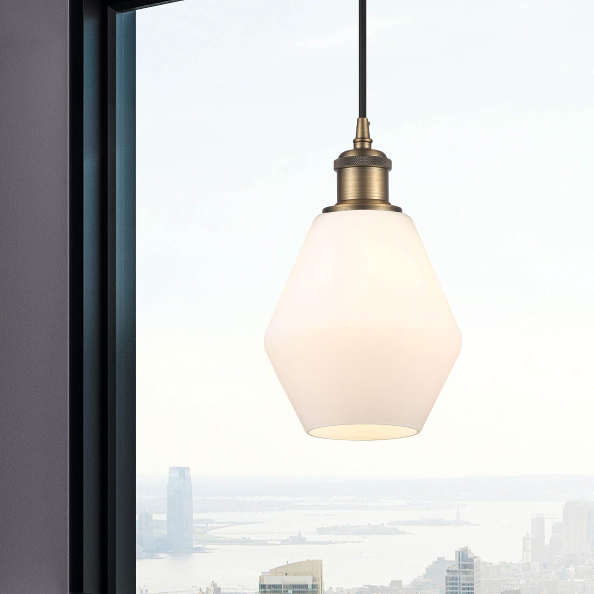 Shown in Brushed Brass finish and Matte White glass