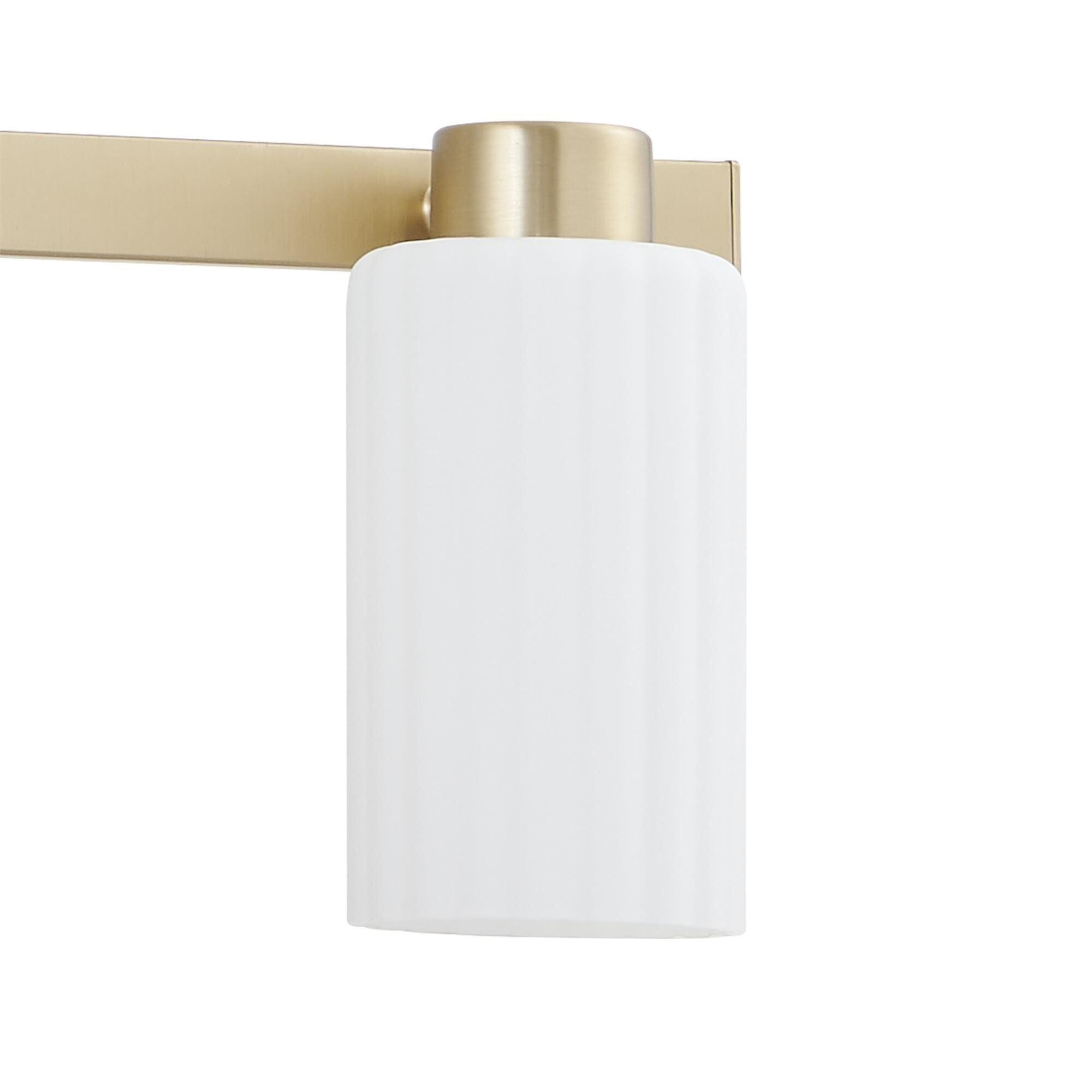 Shown in Champagne Gold finish and Etched Opal Ribbed glass