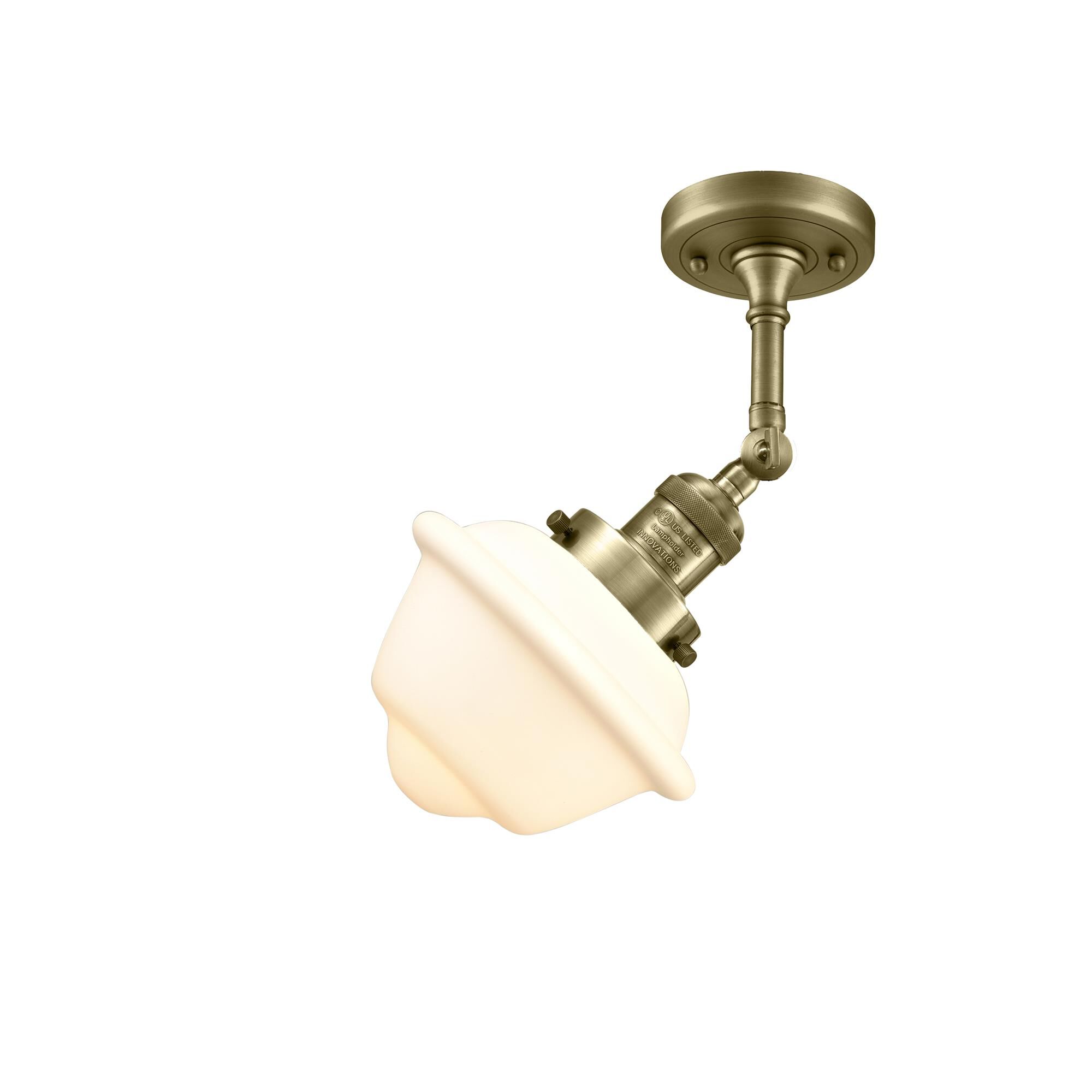 Shown in Antique Brass finish and Matte White Cased glass
