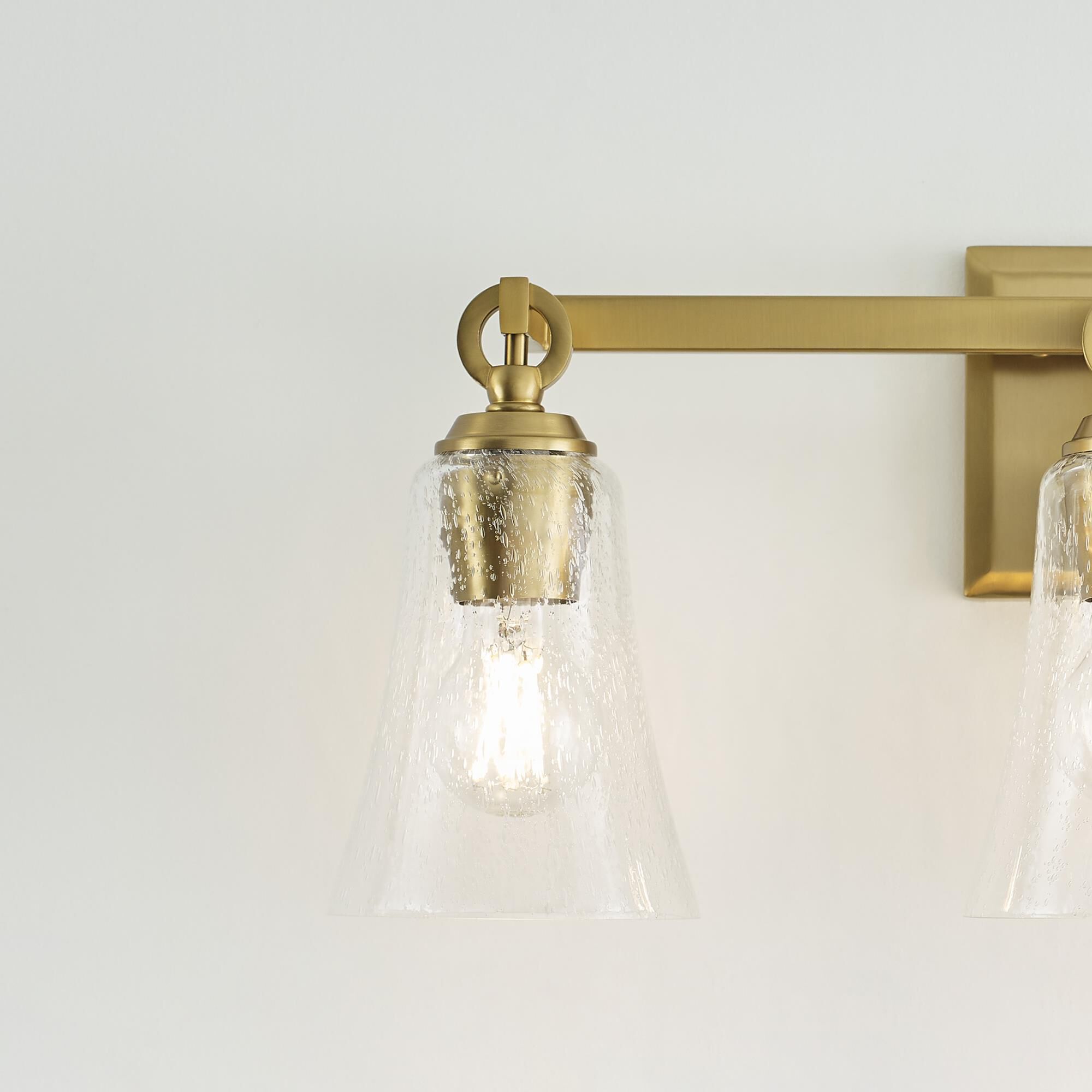 Shown in Burnished Brass finish and Clear Seeded glass