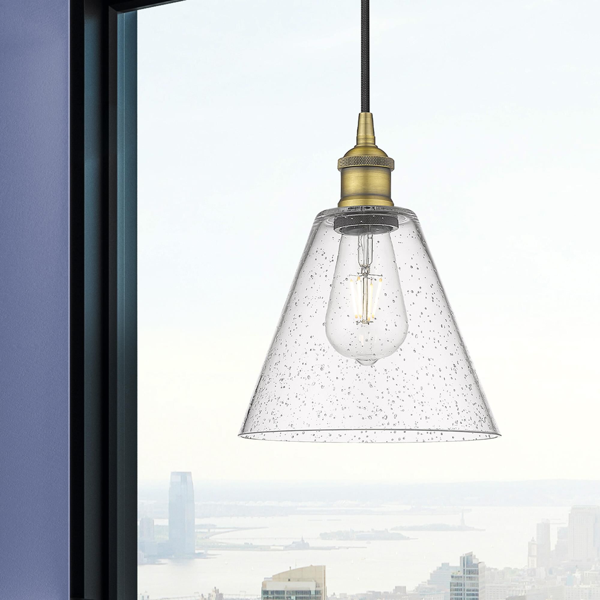 Shown in Brushed Brass finish and Seedy glass