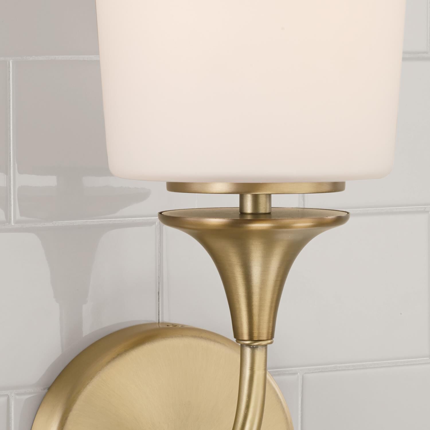 Shown in Aged Brass finish and Soft White glass