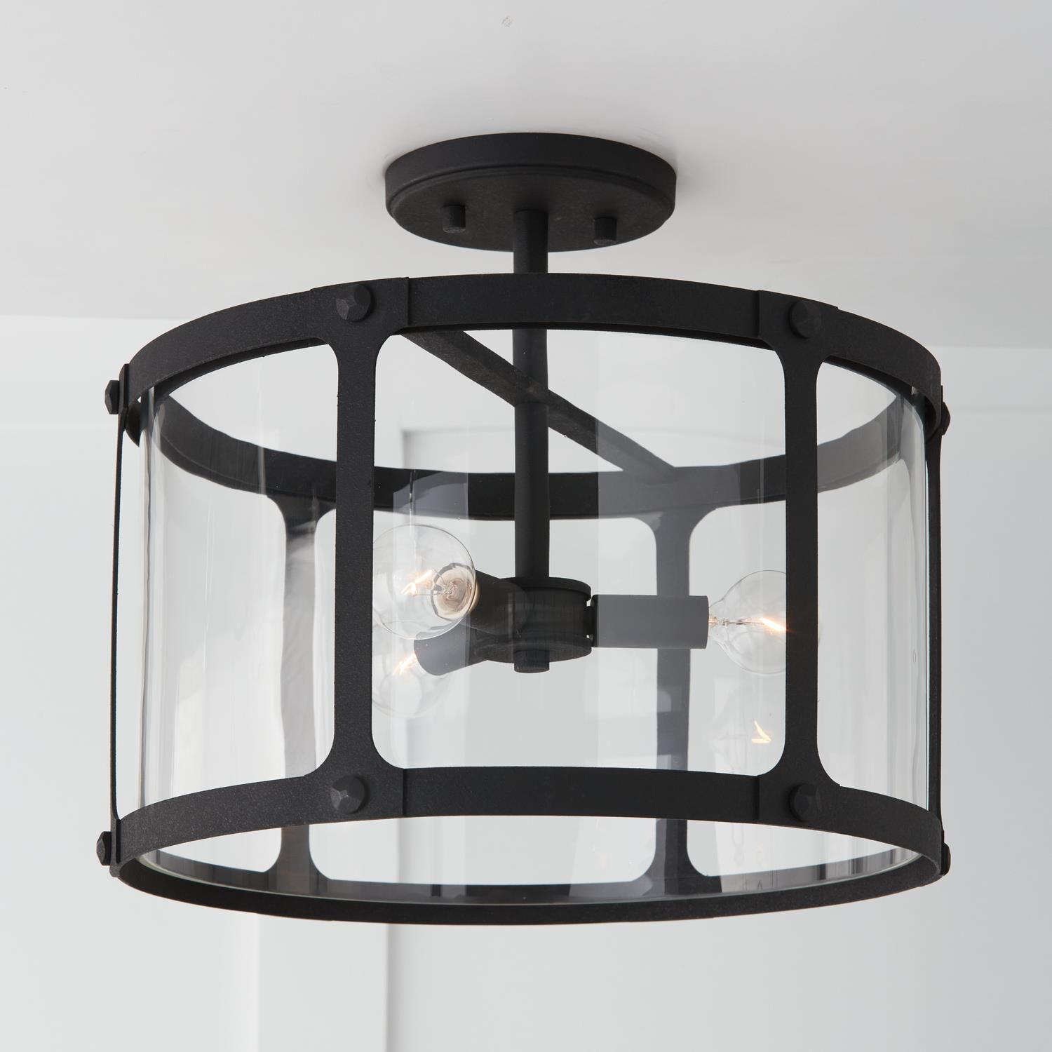 Shown in Black Iron finish and Clear glass