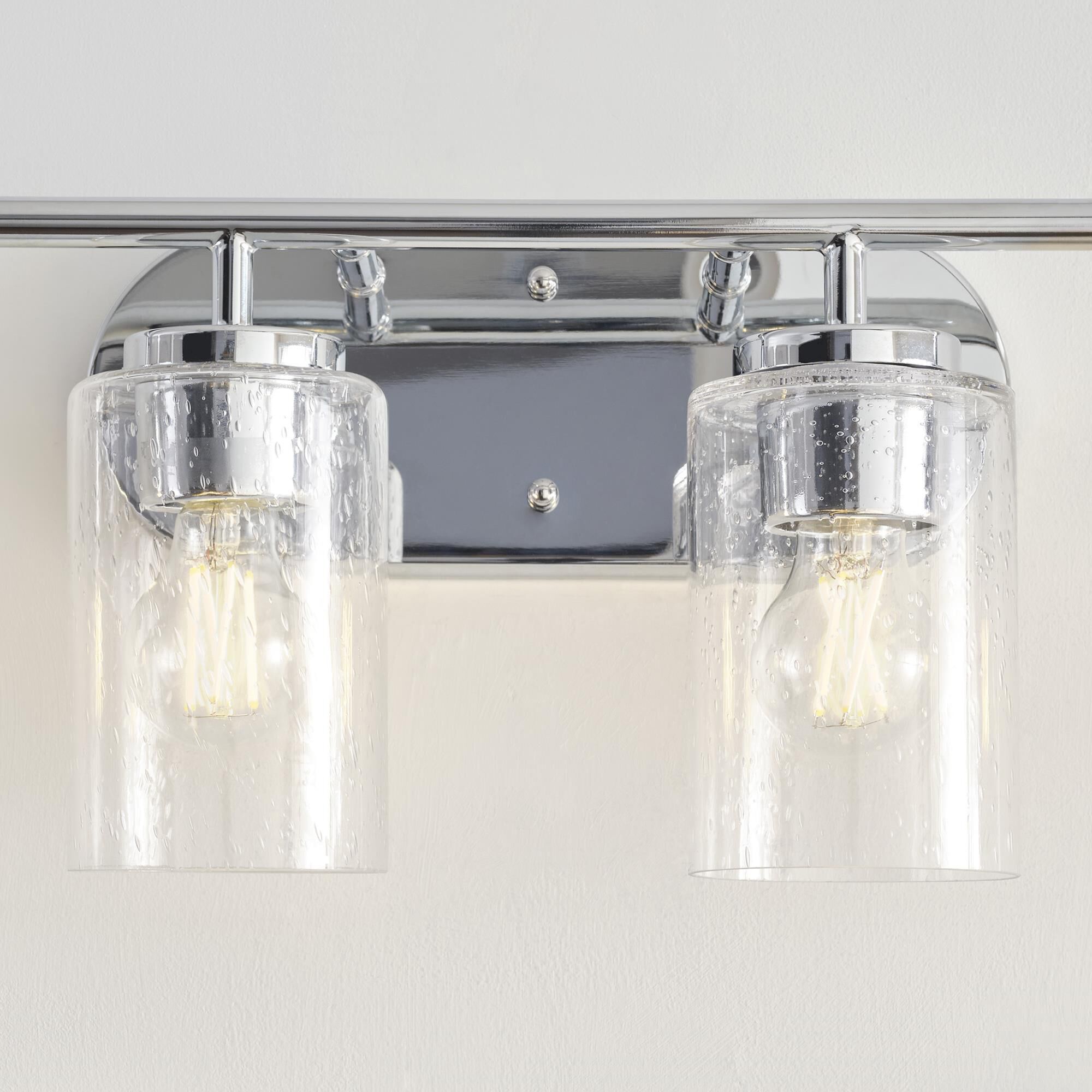 Shown in Chrome finish and Clear Seeded glass